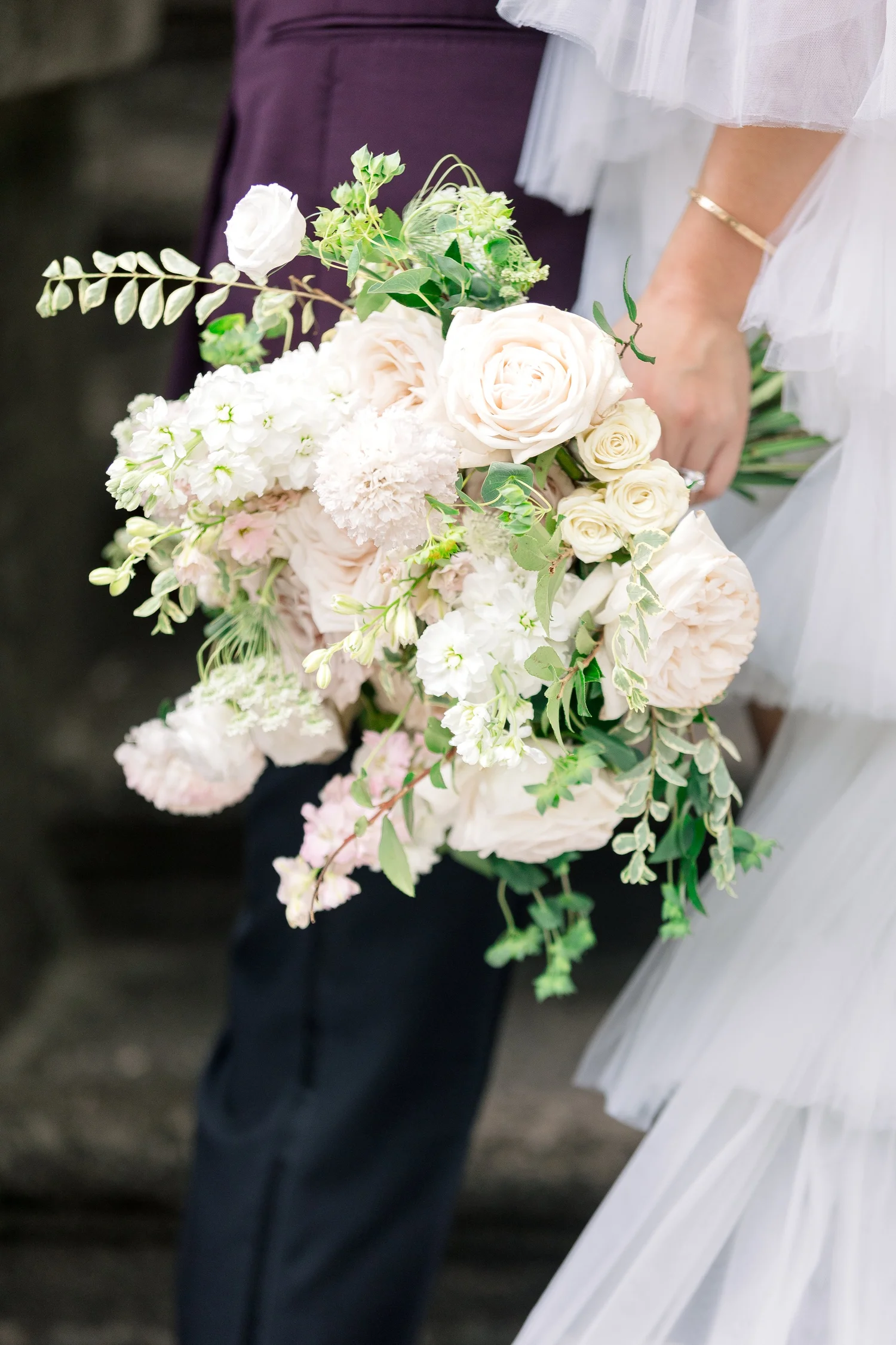 White and blush bridal bouquet at the Swan House gardens