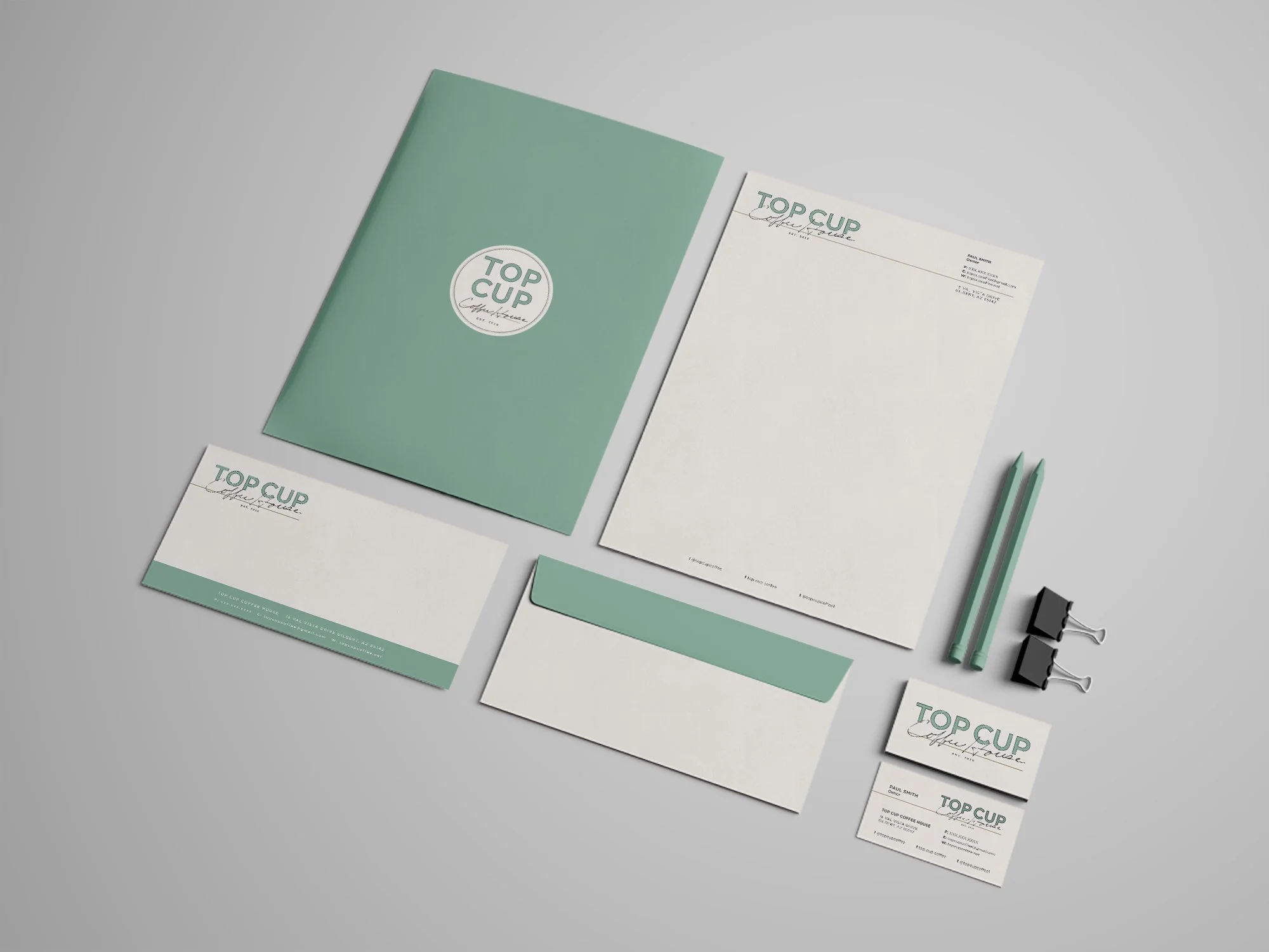 Top Cup stationery including folder, letterhead, envelope, and business card in an aesthetic layout.
