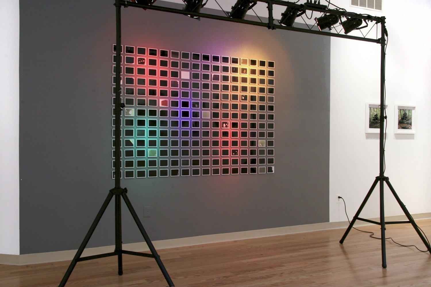 Installation view: Polaroids, lights, , gels, glitter, paint