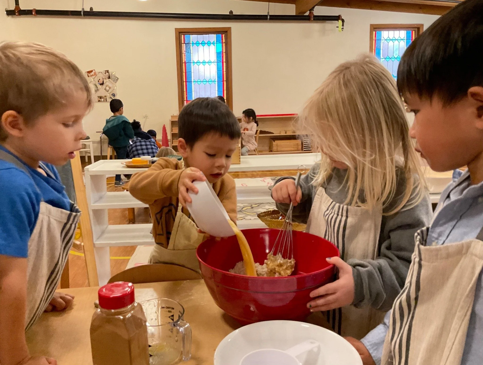 Baking is a favorite practical life activity in our classrooms! Through measuring, pouring, and transferring, children build fine and gross motor skills&mdash;all while having fun. And what makes banana bread even more delicious? Baking it with frien