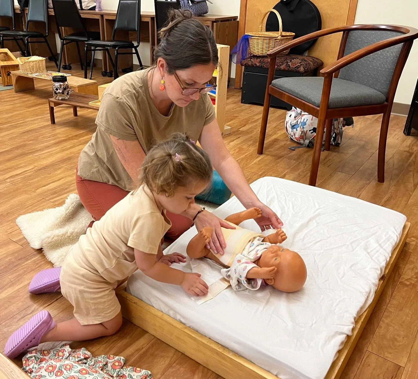 In this quiet moment of shared work during Parent-Child class, something deeper unfolds - not only coordination and independence, but also trust, connection, and a shared understanding of the child&rsquo;s growing capabilities. These simple experienc