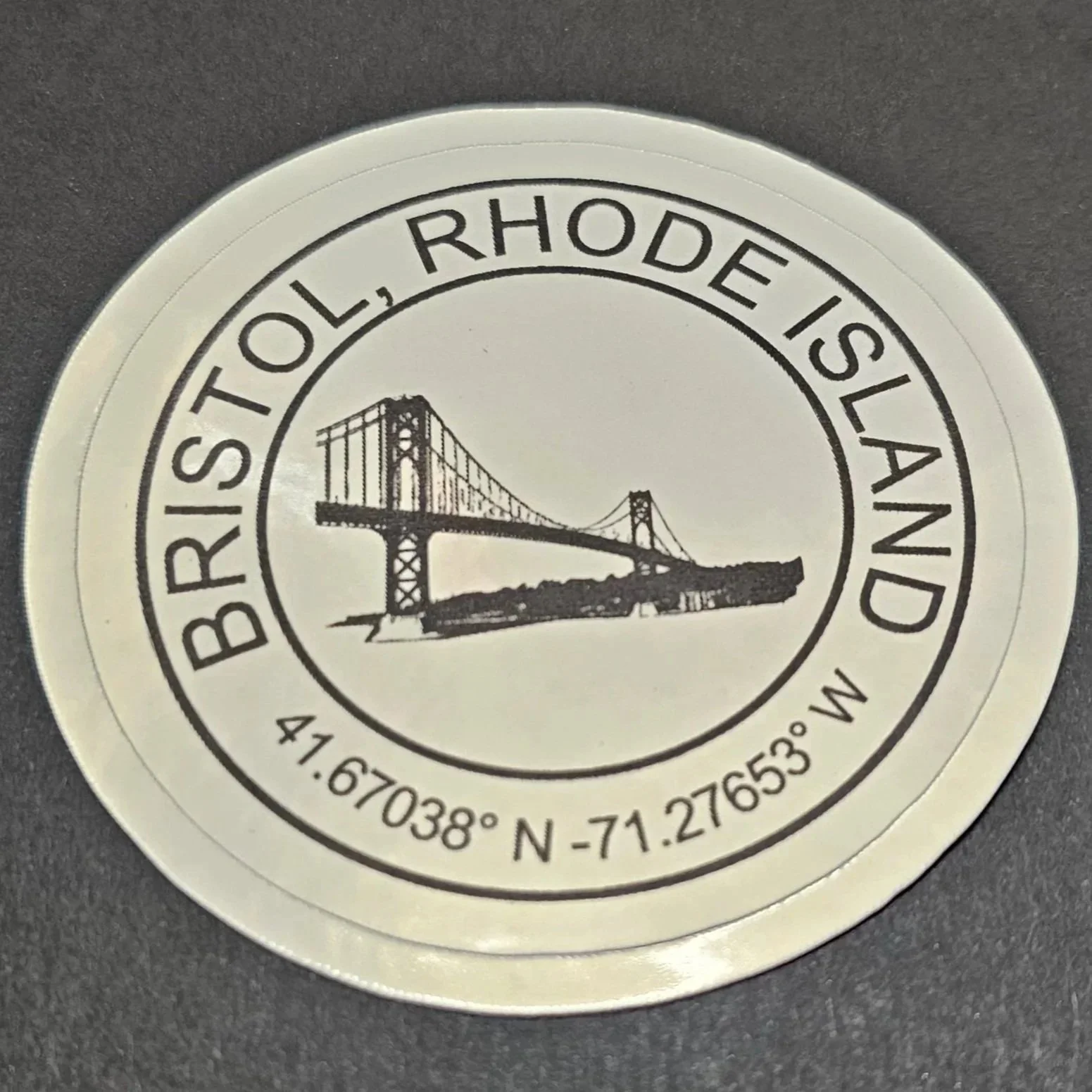 Peel & Stick Vinyl Decal
Measures 2.75 inches.  
Bristol Rhode Island - Actual Coordinates