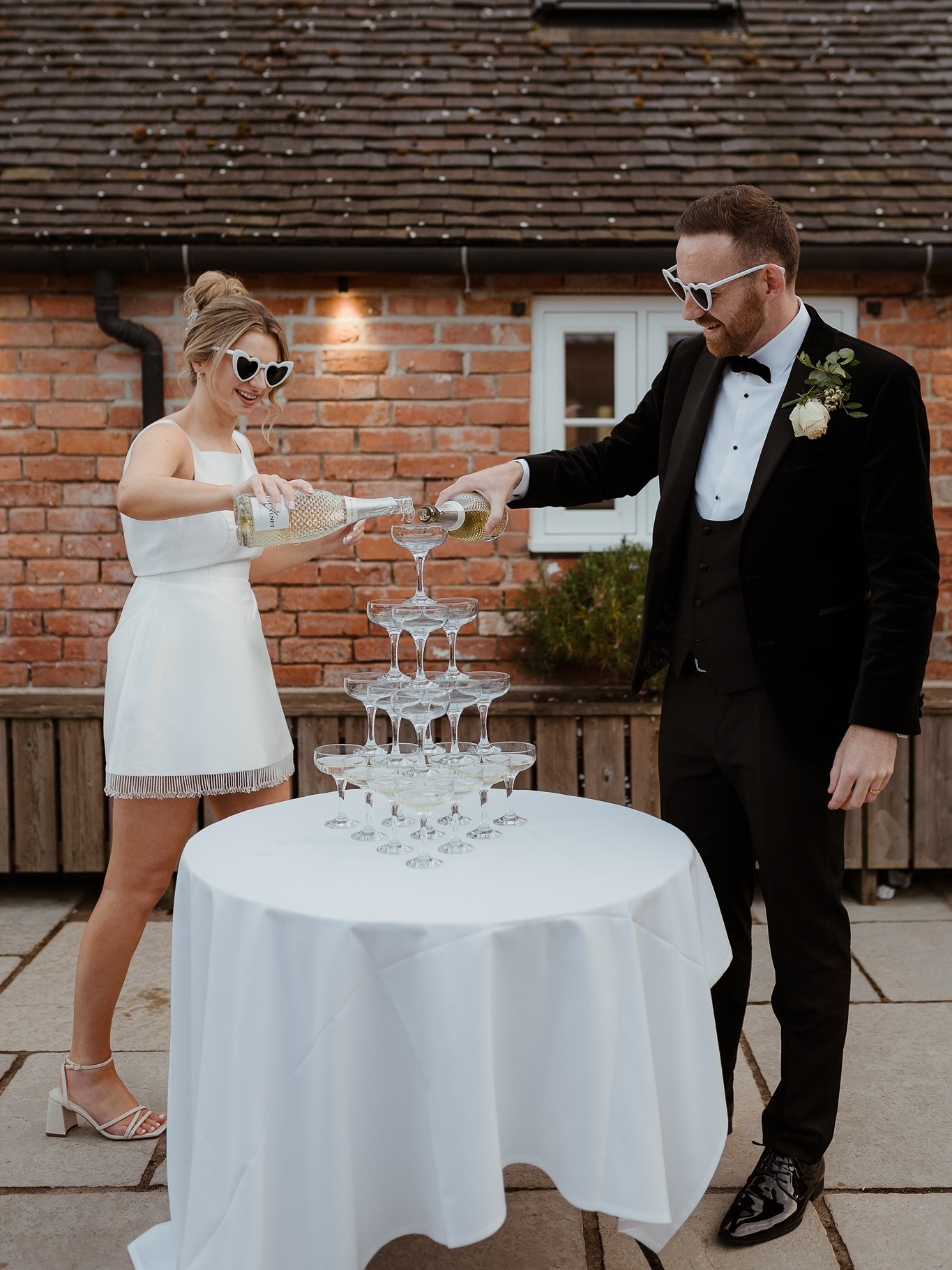 Effortlessly chic, endlessly in love 🤍
C&amp;G in a champagne dreams and newlywed magic. Celebrating love the only way we know how - elegantly and all in! 🥂
.
photographer: @thatweddings 
venue: @hanburybarnsvenue 
coordinator: @kelly_anneweddings 