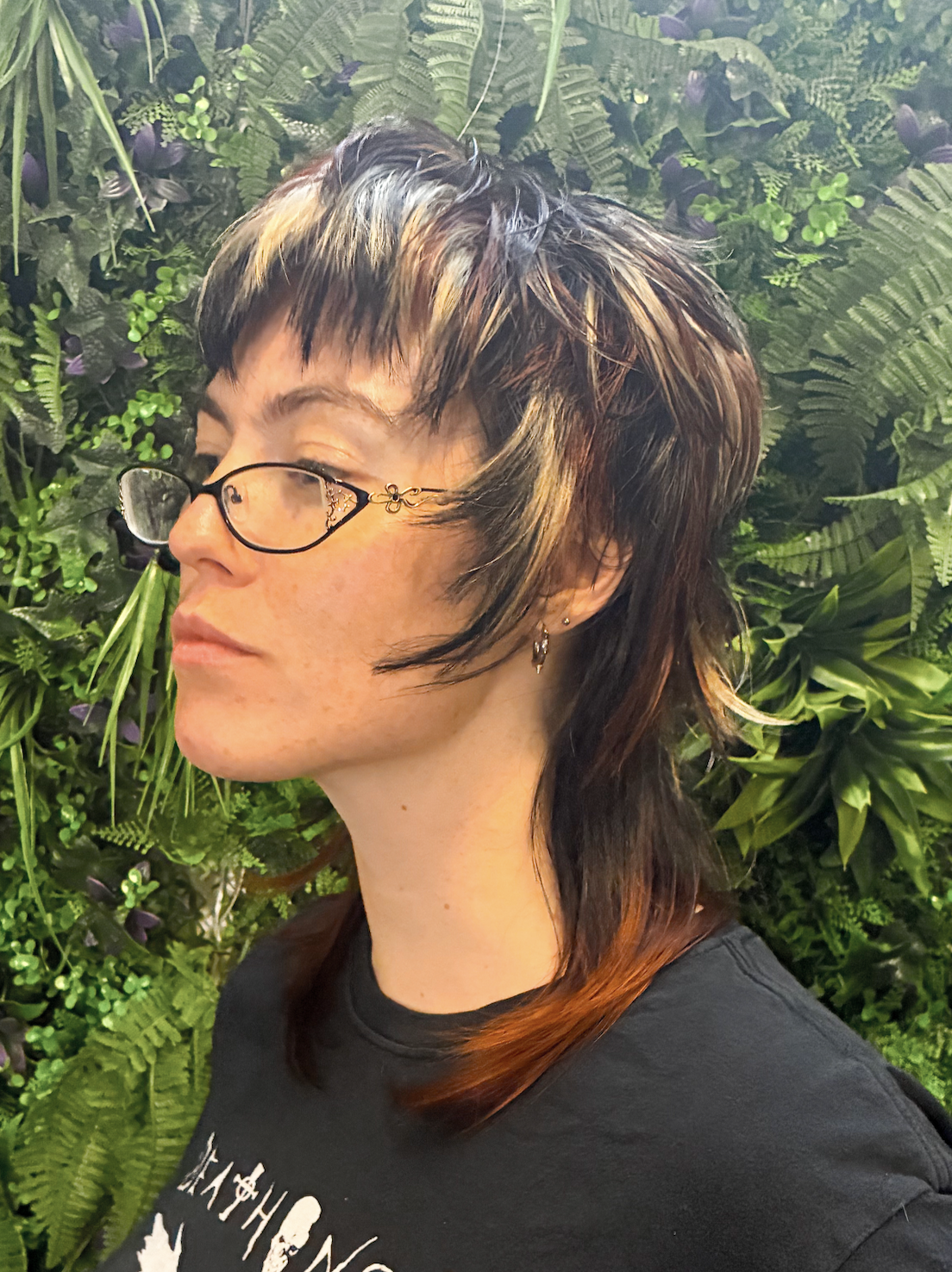 Calico striped layered jellyfish cut with black face framing and ombre black to red on the long pieces