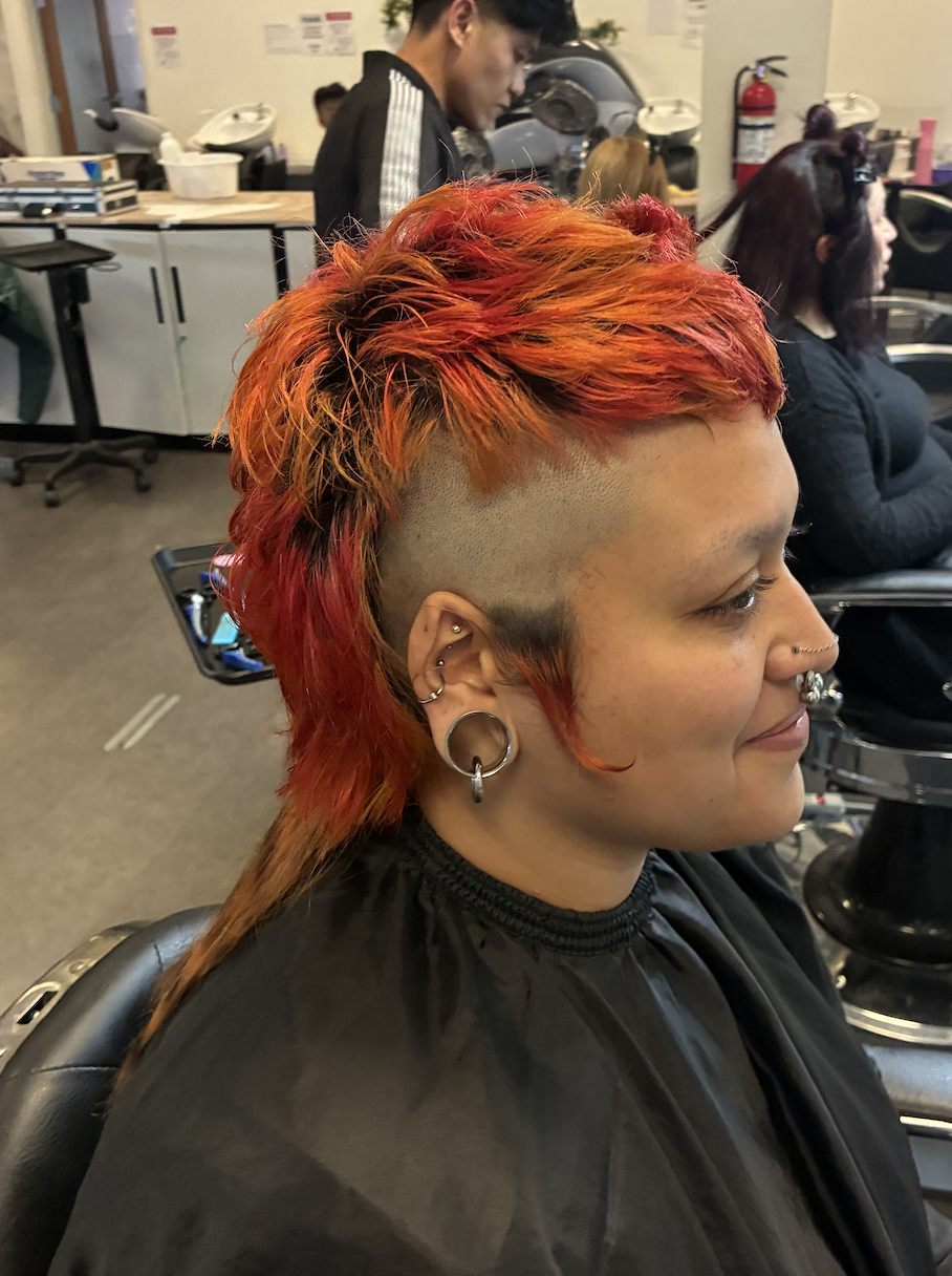 Textured short mullet with sides shaved and rat tails