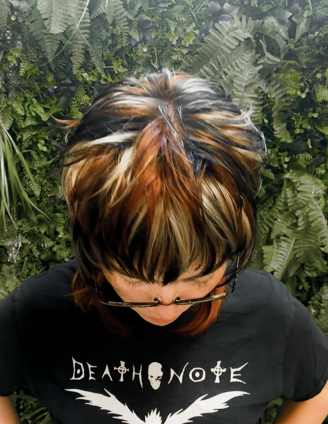 Calico striped layered jellyfish cut with black face framing and ombre black to red on the long pieces