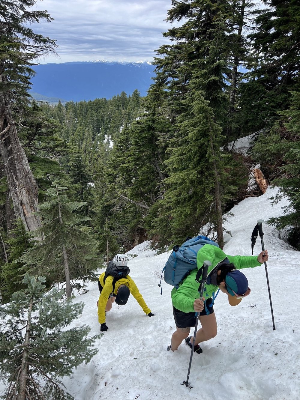  Chris and Liz kickstepping down the steep slope from the top of Alouette.  