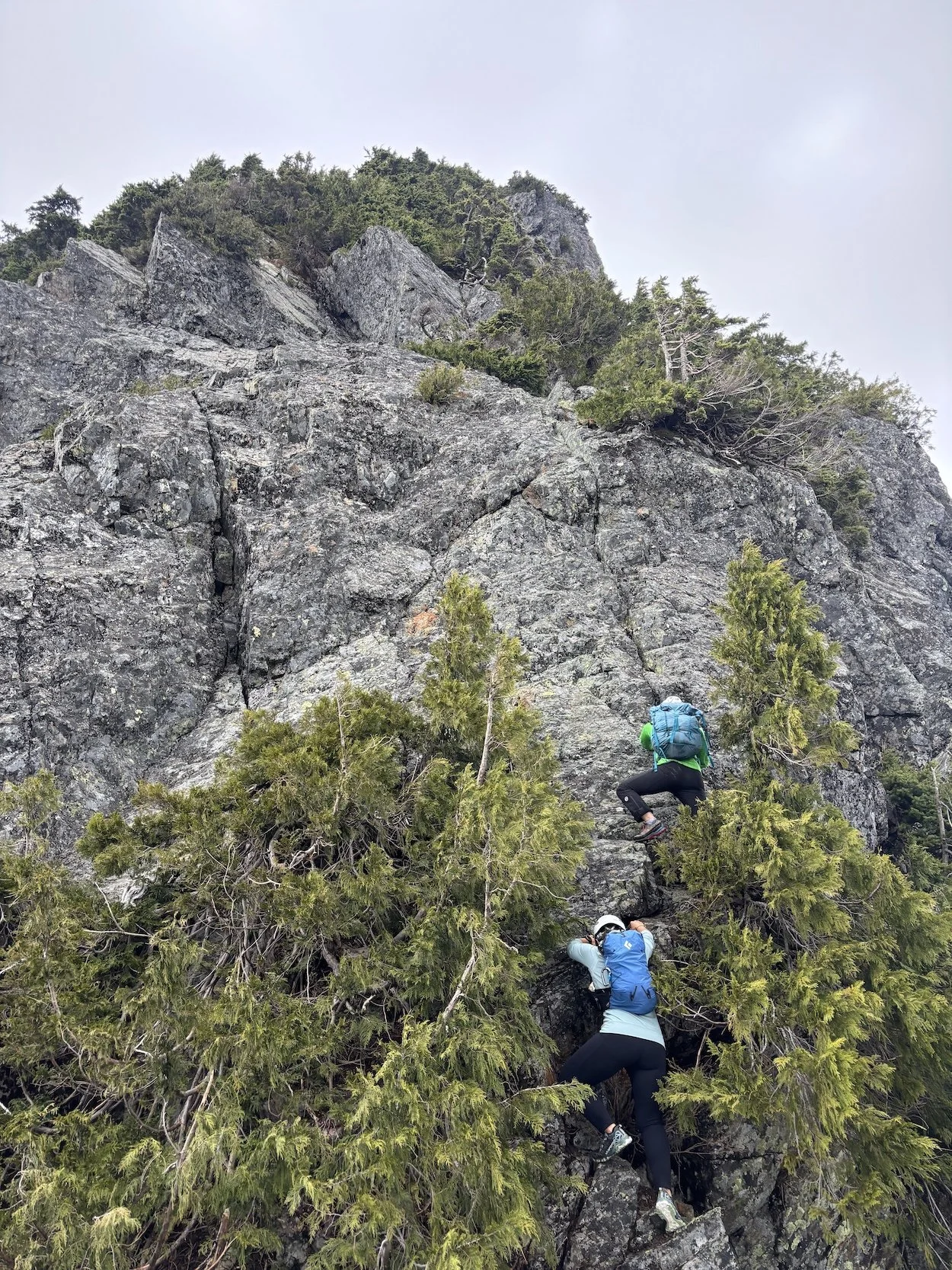  Liz and I starting to scramble up the first pitch of Blanshard. As the crux pitch, it goes at 5.4.  