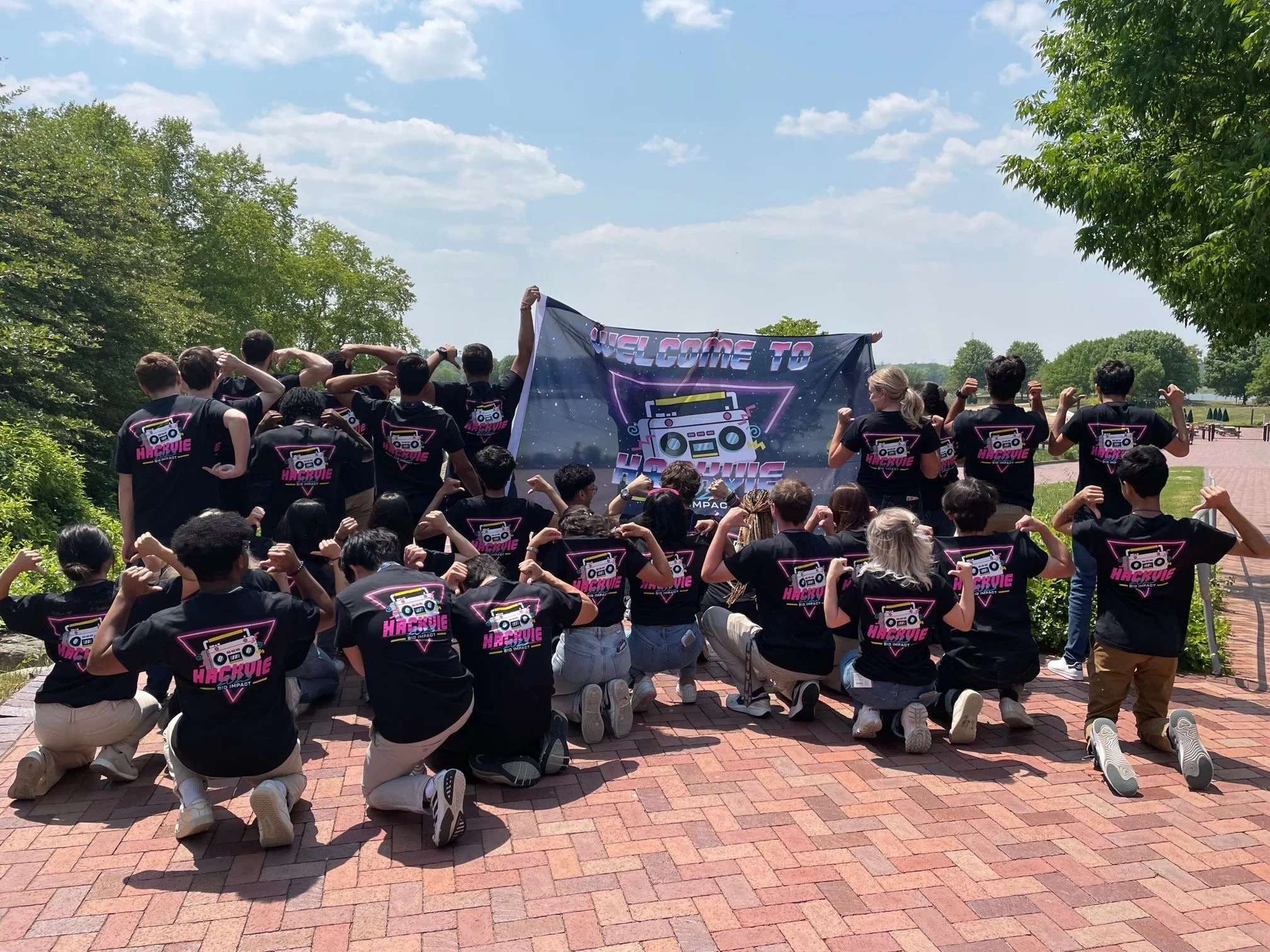 Students showing off their HackVie shirts