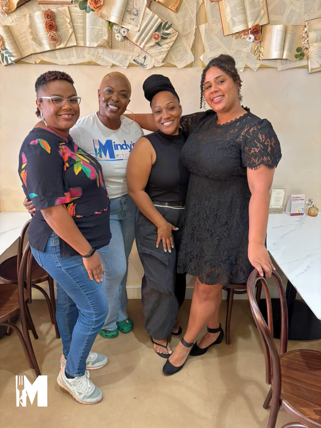 Four ladies posing with a smile on their face