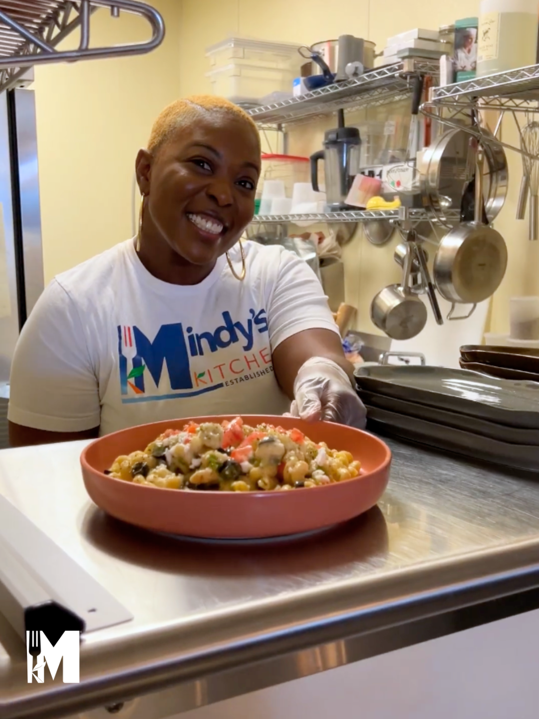 Image of Melissa serving pasta salad on a coral salad plate