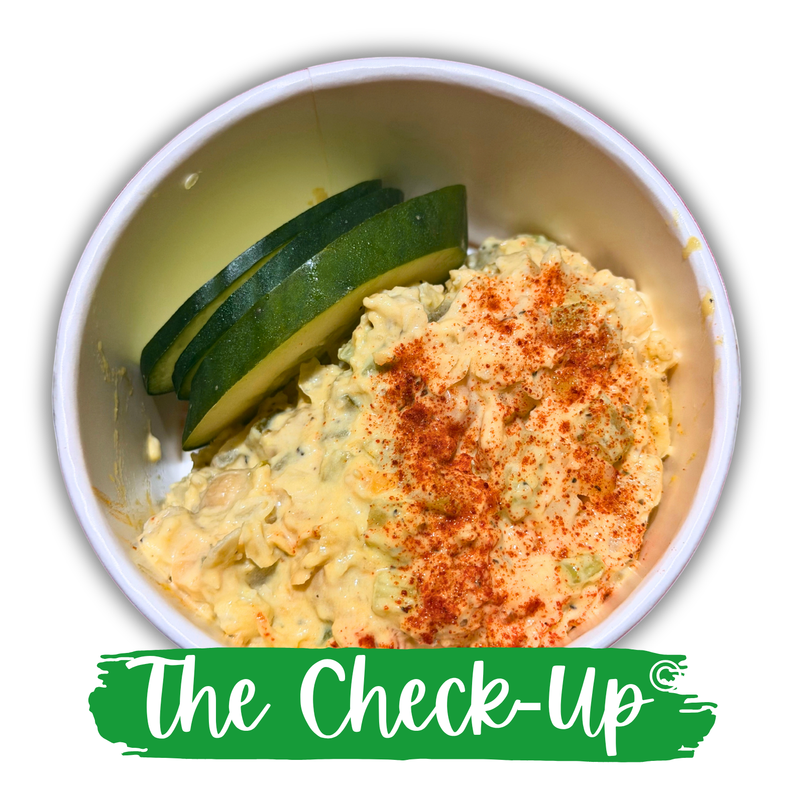 The Check-Up creamy tuna salad topped with paprika and served with sliced cucumber