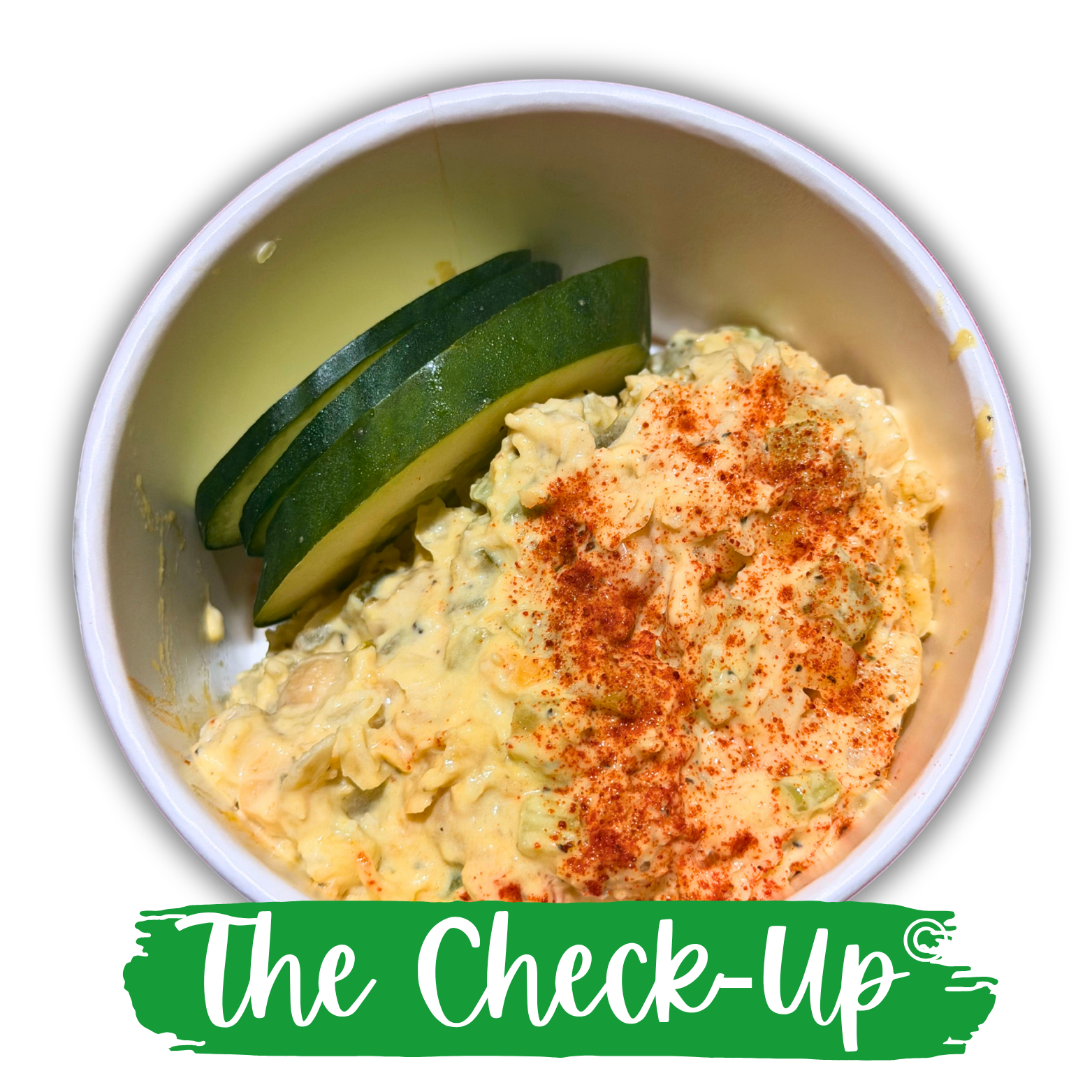 The Check-Up creamy tuna salad topped with paprika and served with sliced cucumber.