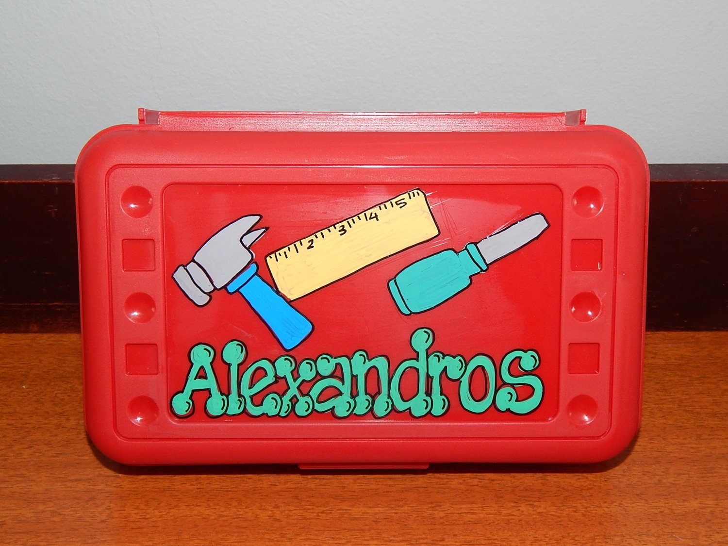 DIY party favors. Personalize pencil boxes with paint pens (we got these  from Michael's) and fi…