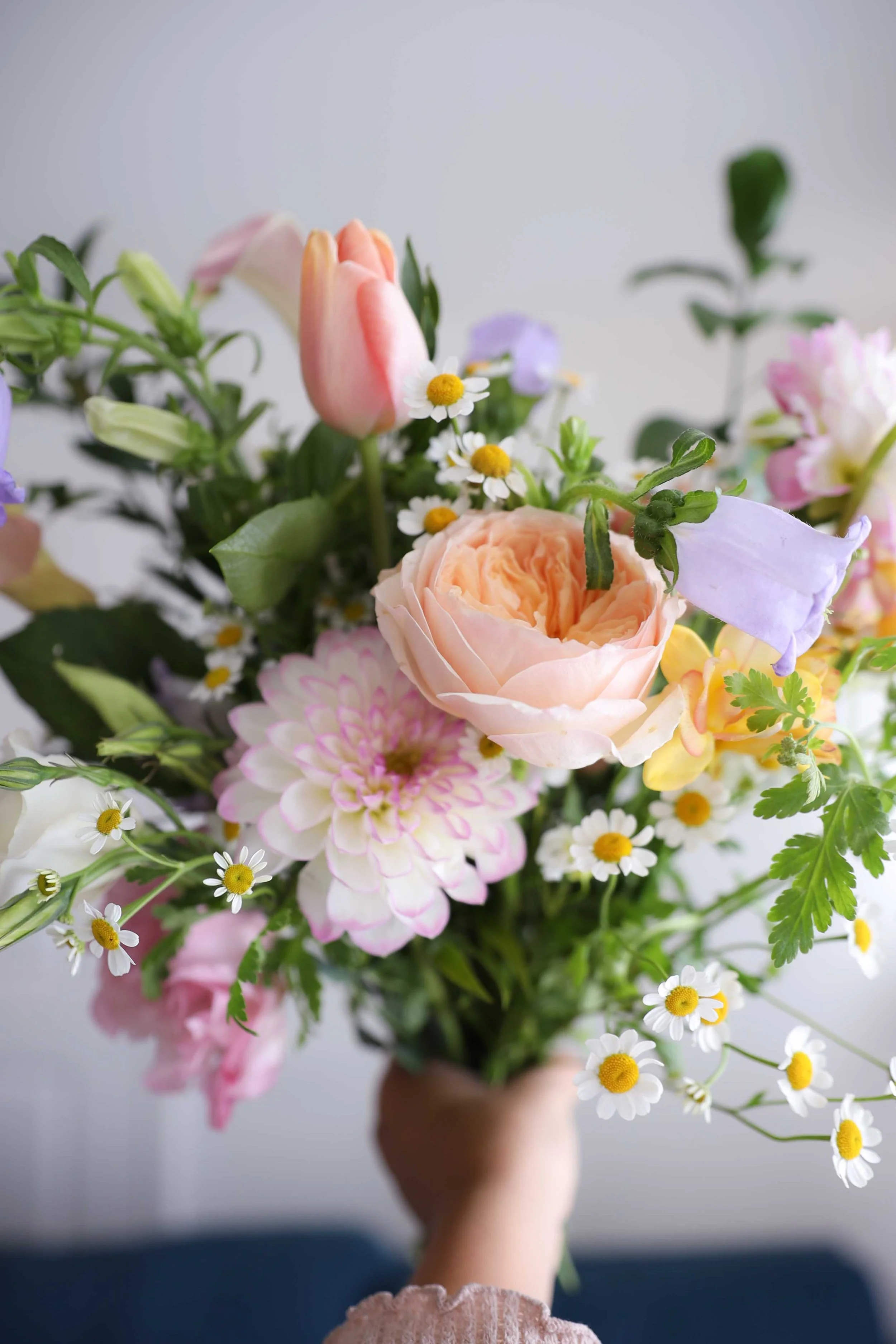 Bright celestial petals interspersed with star and planet motifs on a dark background