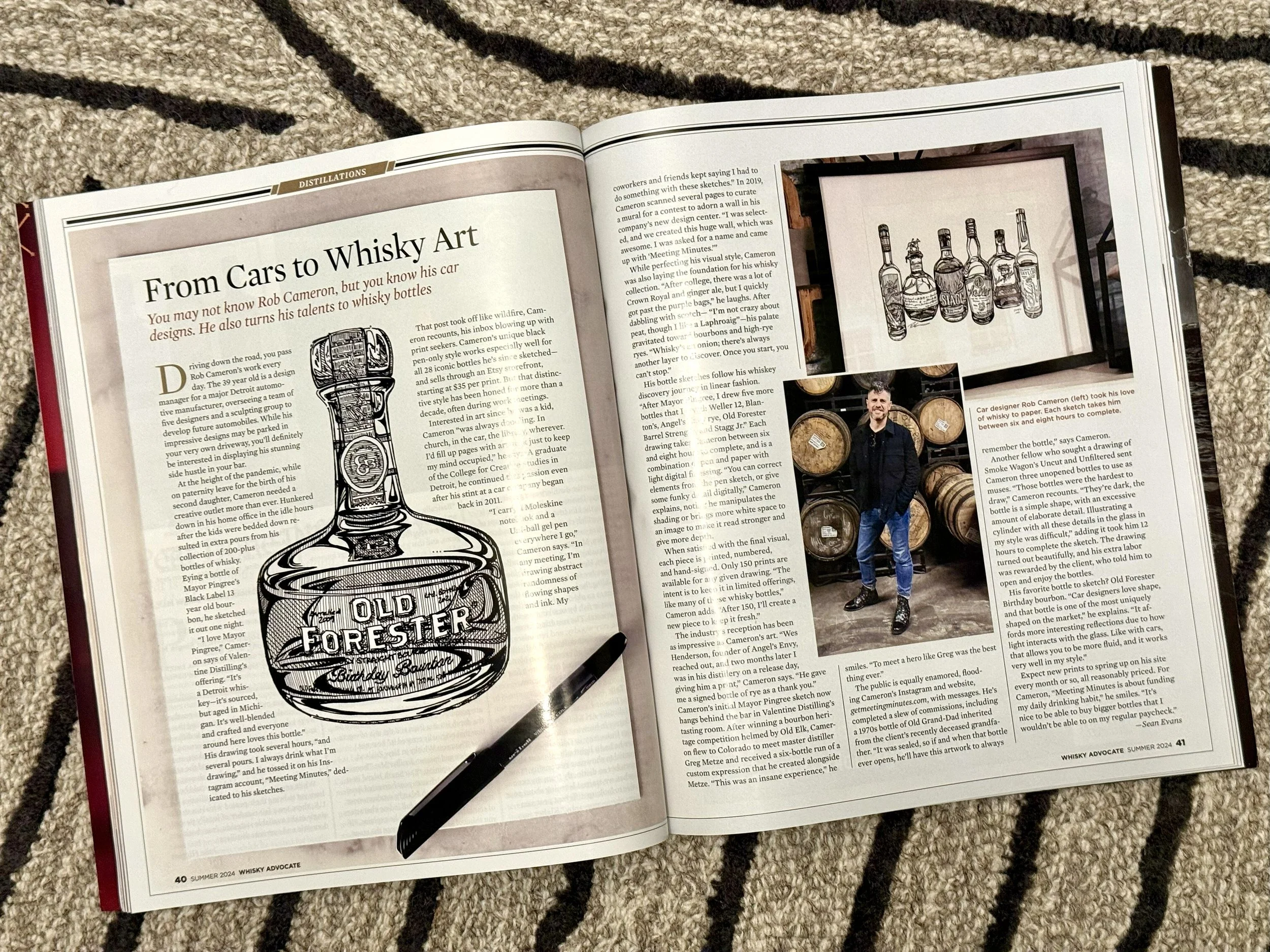 An open magazine displaying an article titled "From Cars to Whisky Art" from Whisky Advocate Magazine - Featuring Rob Cameron - Whisky Art - Bourbon Art - Detroit Artist
