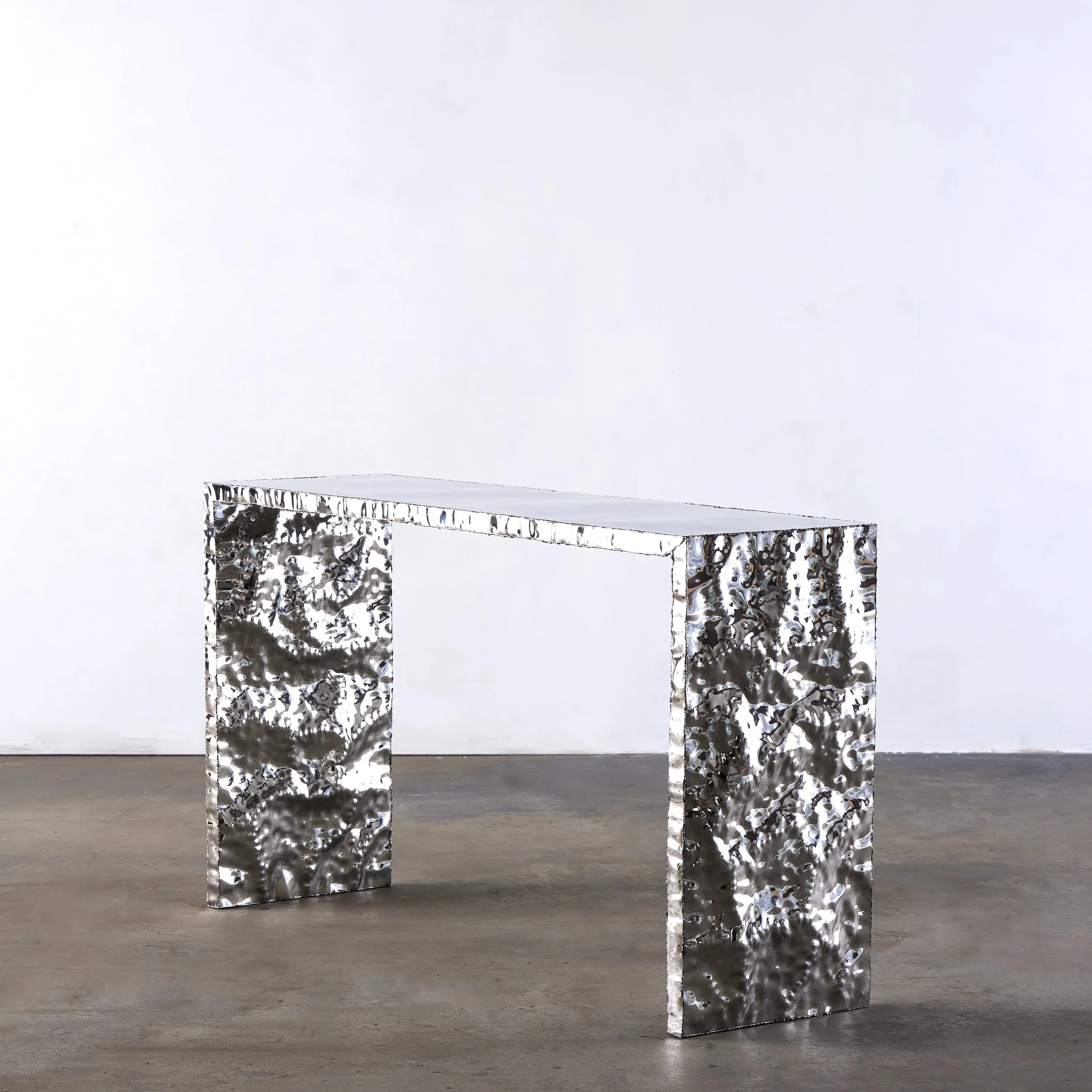 Michael_Gittings_handmade-textured-mirror-polished-stainless-steel-table.jpg