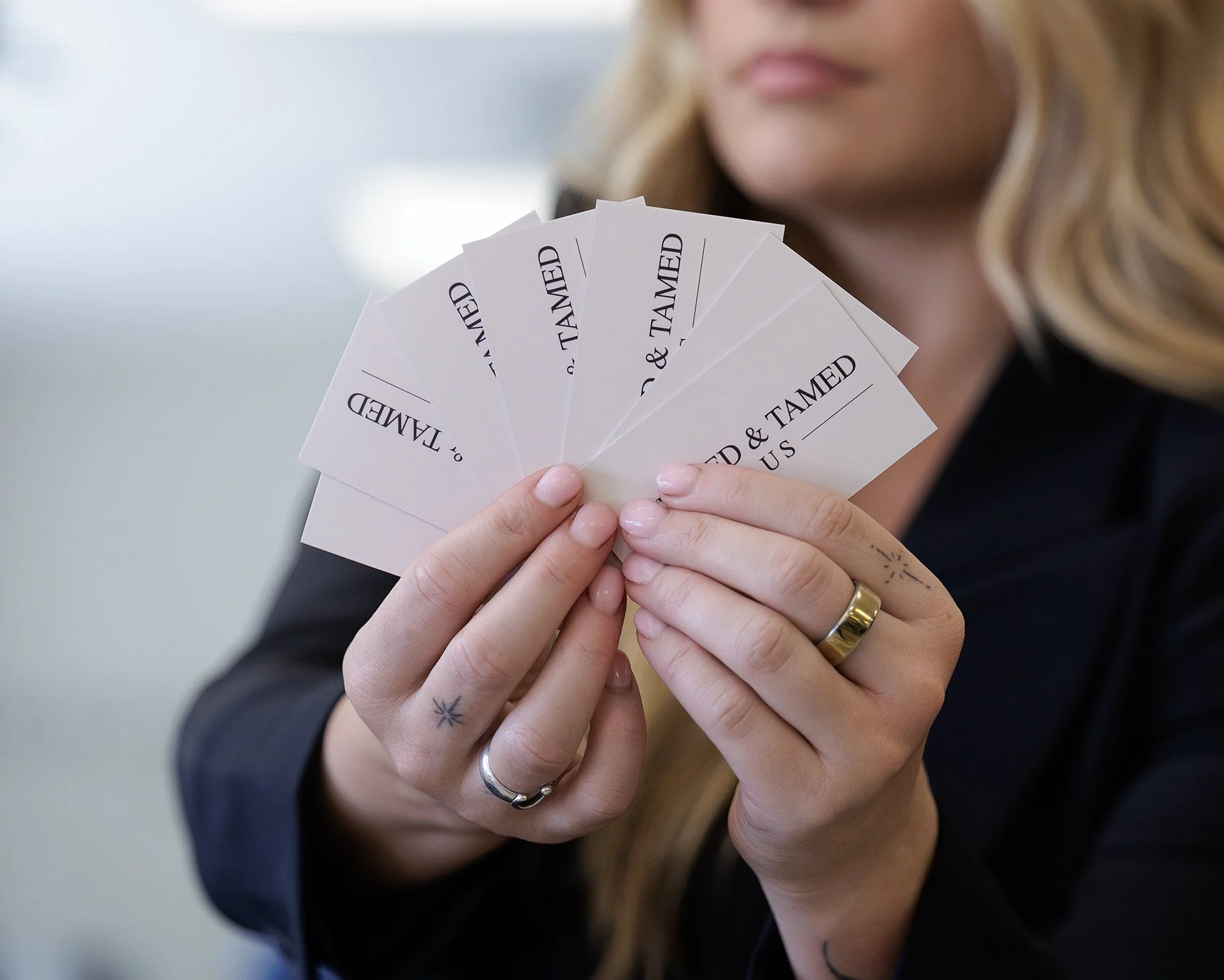 Branding image of girl holding business cards