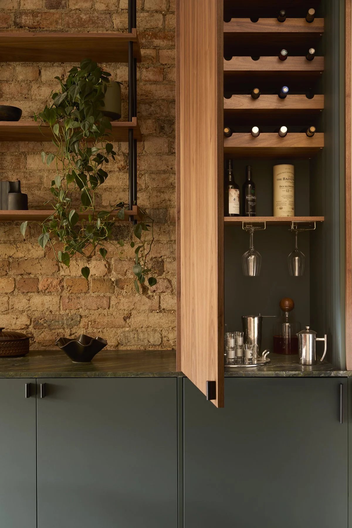 Dining room custom walnut bar with green stone benchtop