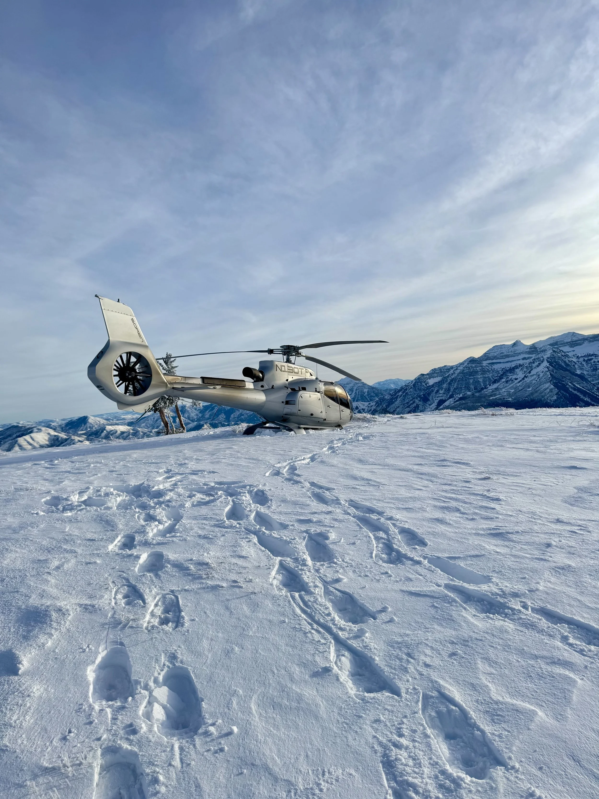H130 on a snowy mountain top