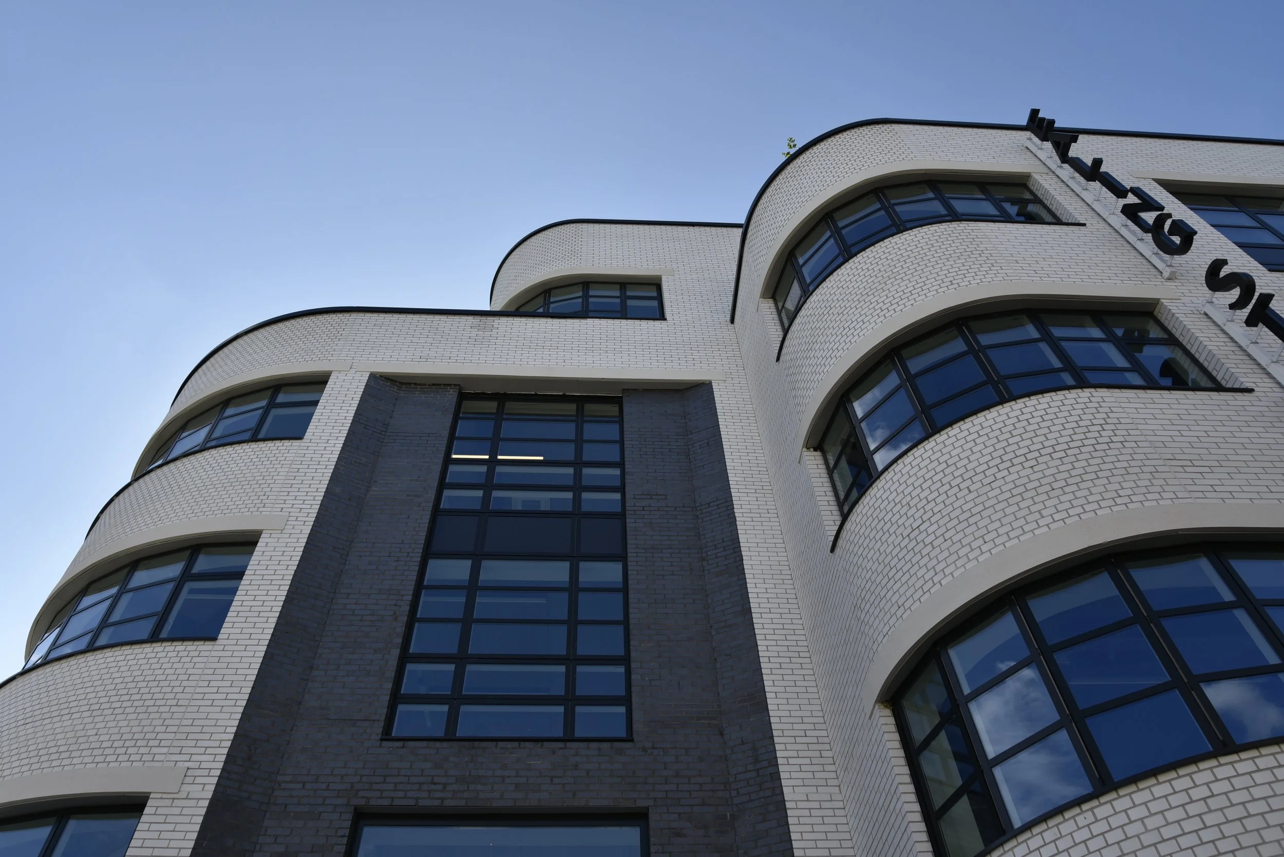 Ealing Studios shot showcasing the white bricks, windows and partial Ealing Studios sign
