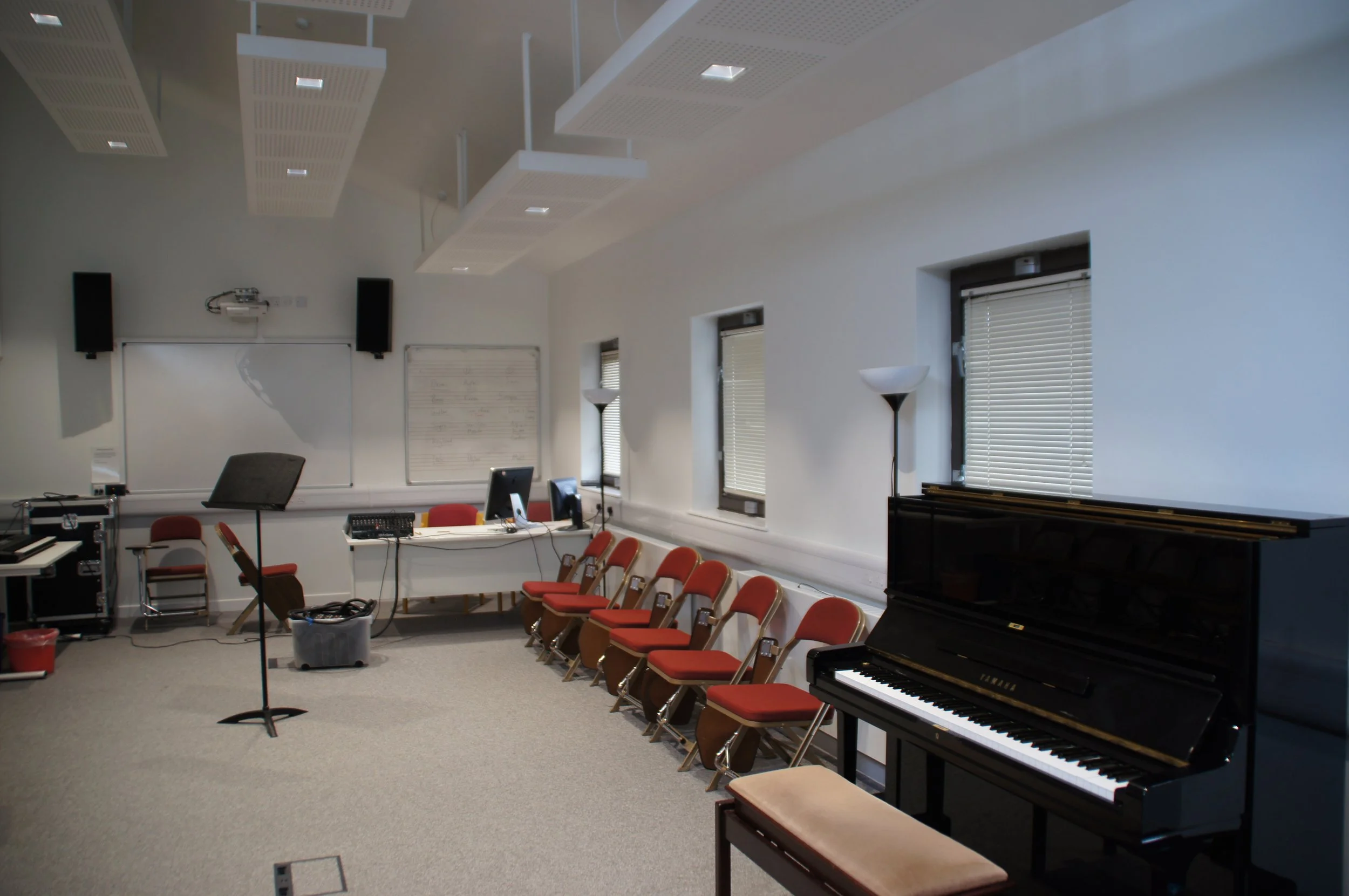 music room with chairs and a piano