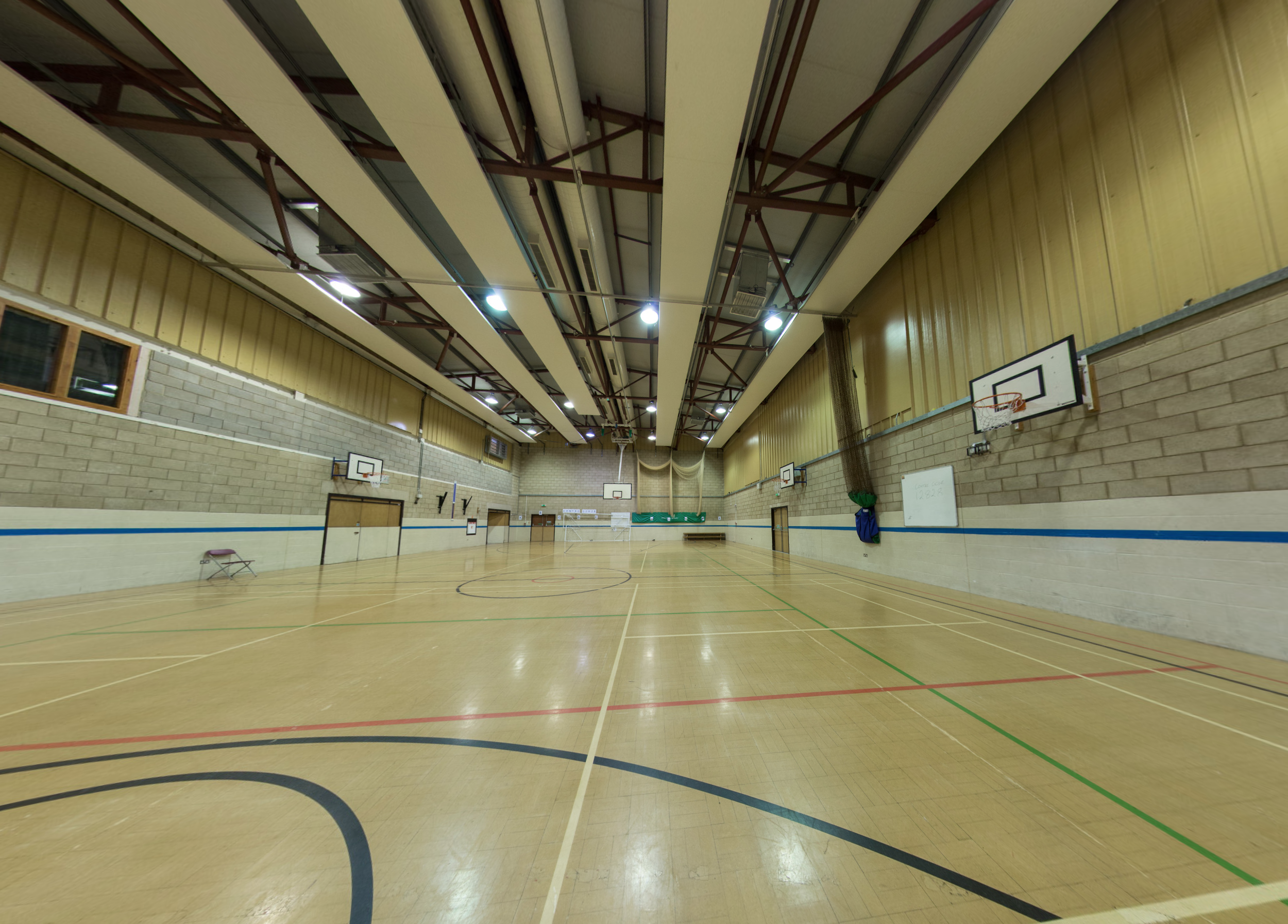 school gymnasium floor with basketball court
