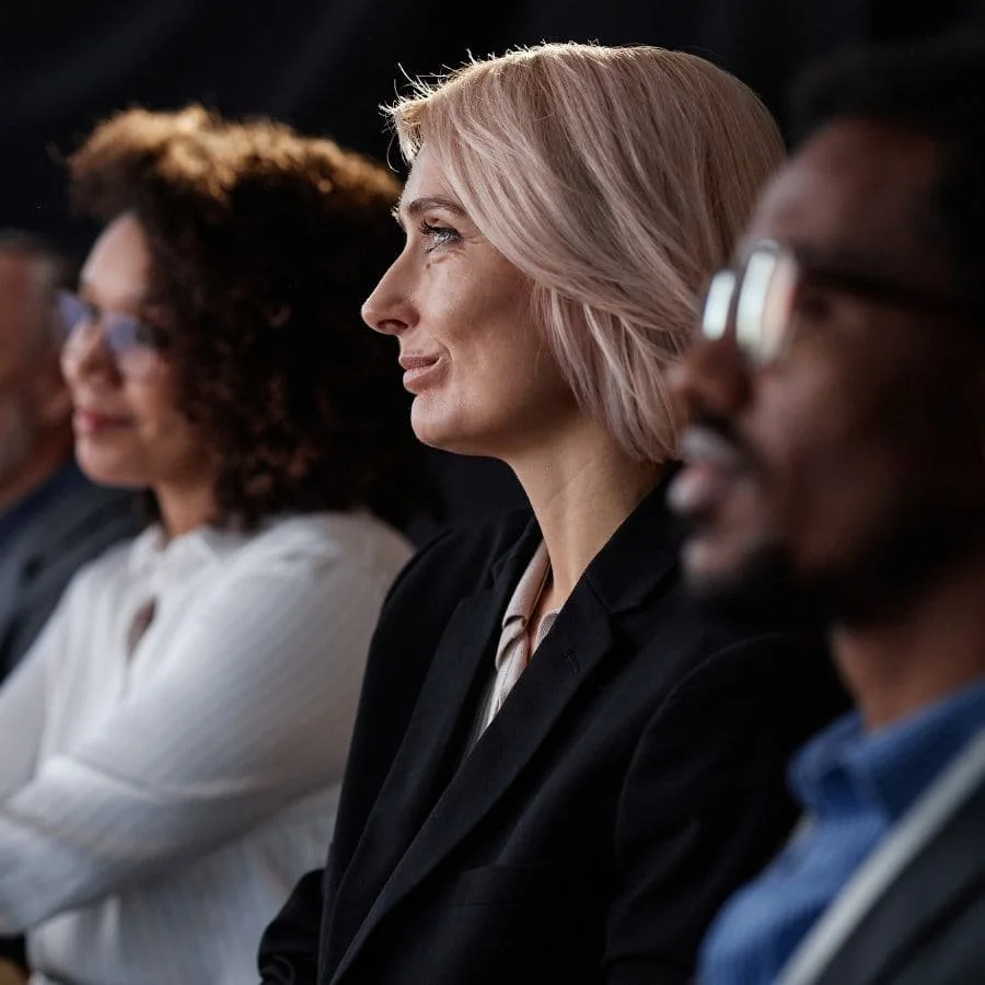 Group of people listening to Seoka Salstrom's coaching