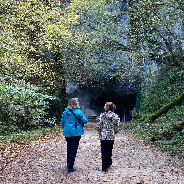 two women hiking and looking at each other during an Athara adventure trip