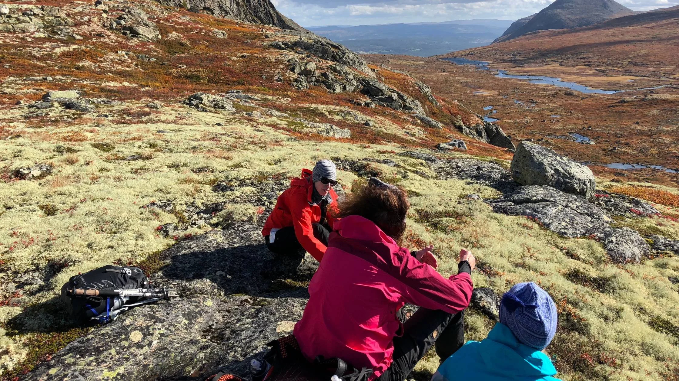 women relaxing on mountain side from Athara trip