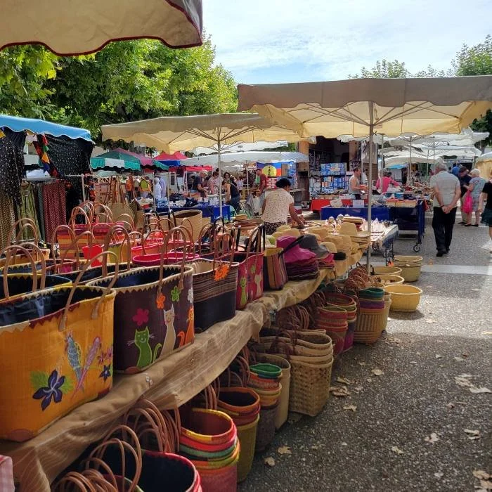 Colorful baskets for sale in a french market.