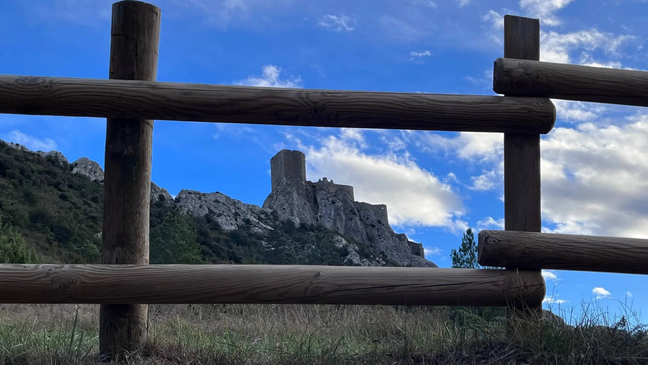 old structure framed by a fence photo from an Athara tour