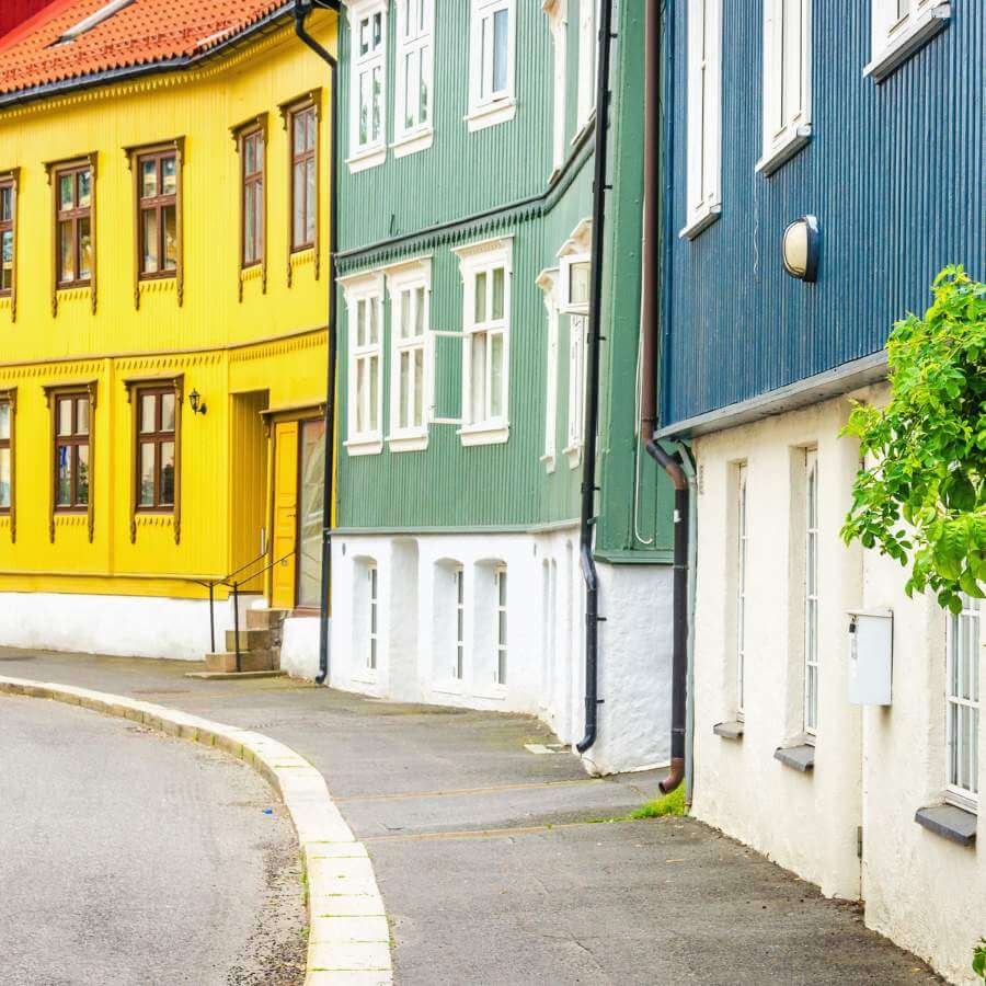Yello, green, and blue houses in Oslo, Norway.