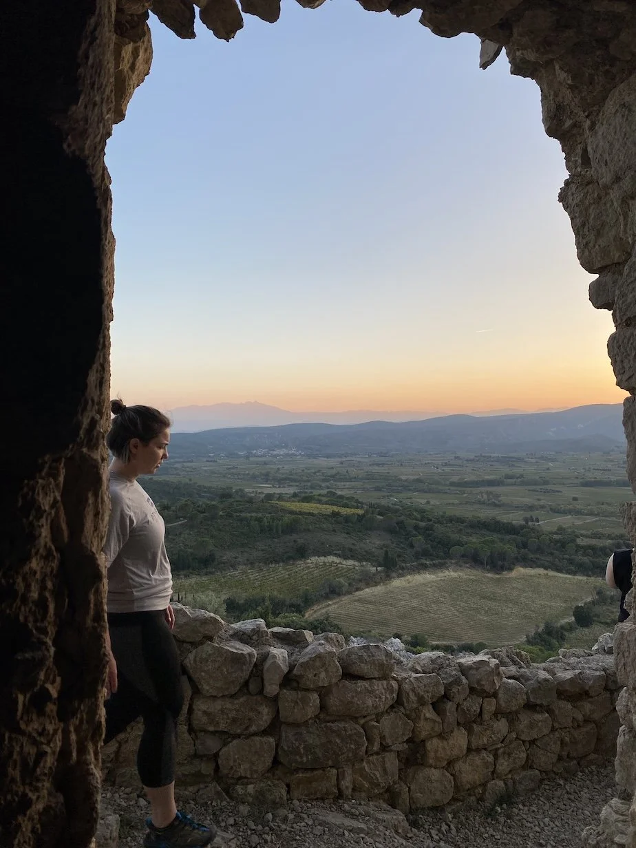 sunset at cathar castle and woman walking
