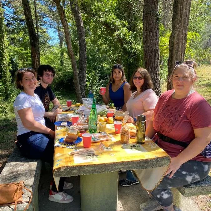 Small group sharing a picnic during an Athara cultural tour in France