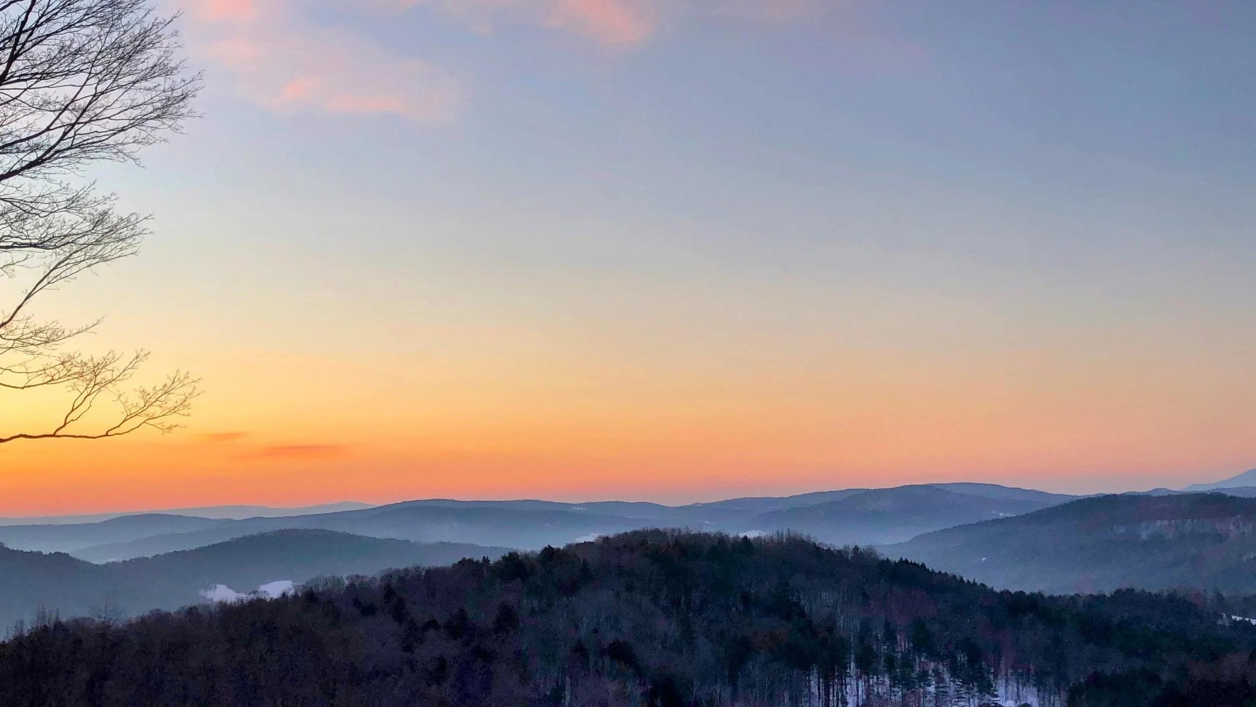 Sunrise in Vermont in the winter with a red sky.