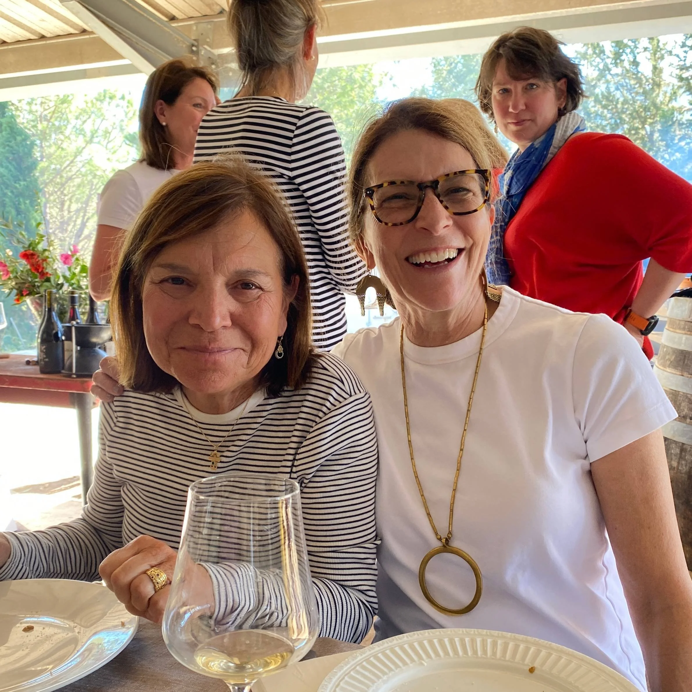 Two women at wine tasting lunch in France organized by Athara Adventures