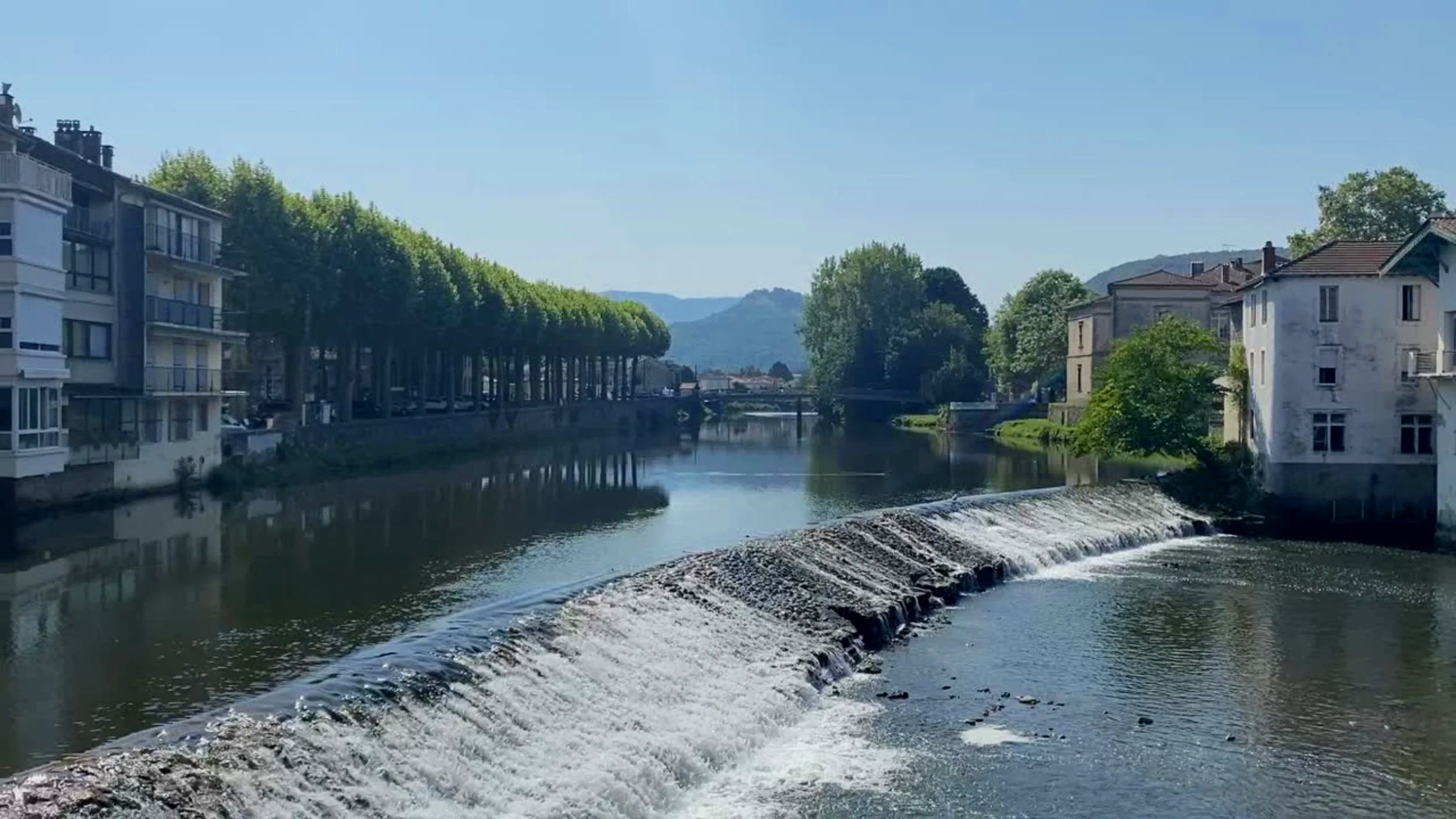 River running through Saint-girons, France on a sunny day.