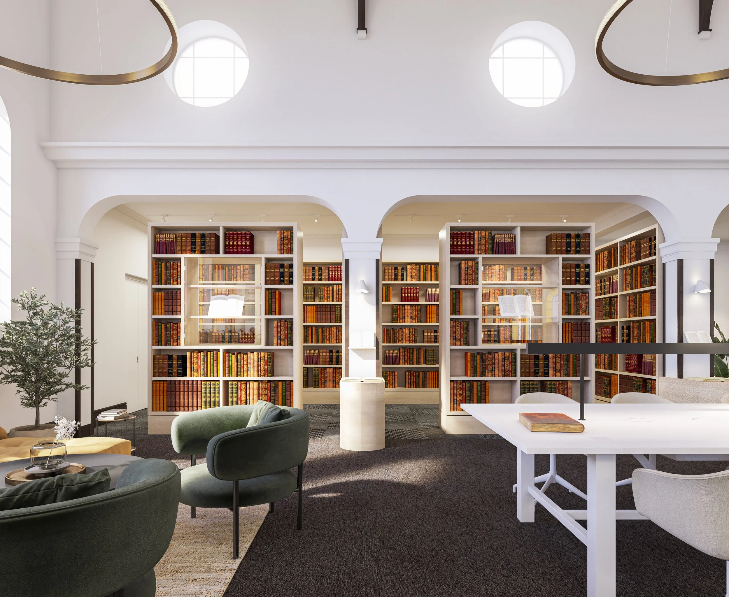 Square Feet Architects — A modern library with white walls, arched doorways, and large circular windows. Shelves filled with colorful books are visible through the arches. Coz