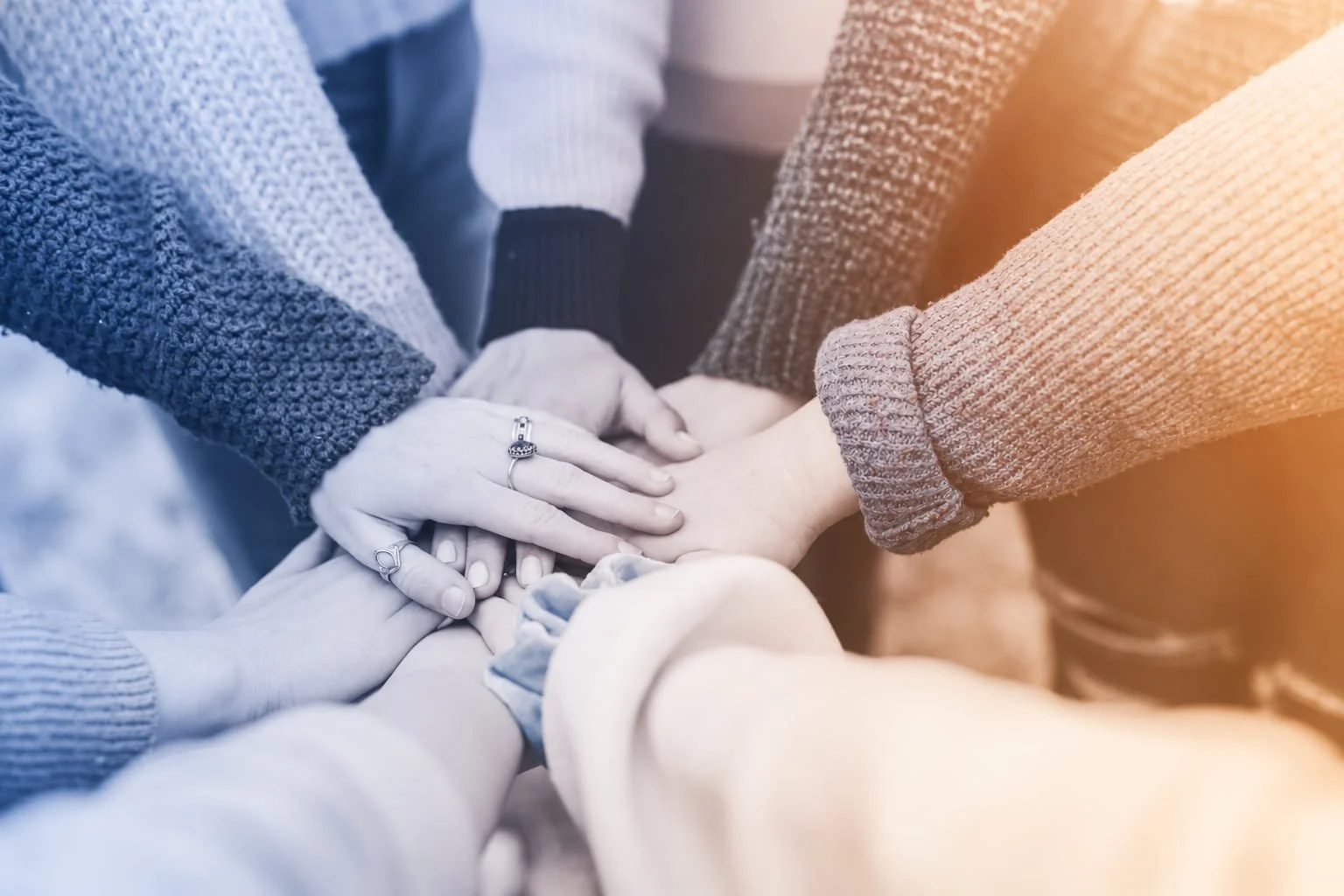 Hands coming together in teamwork