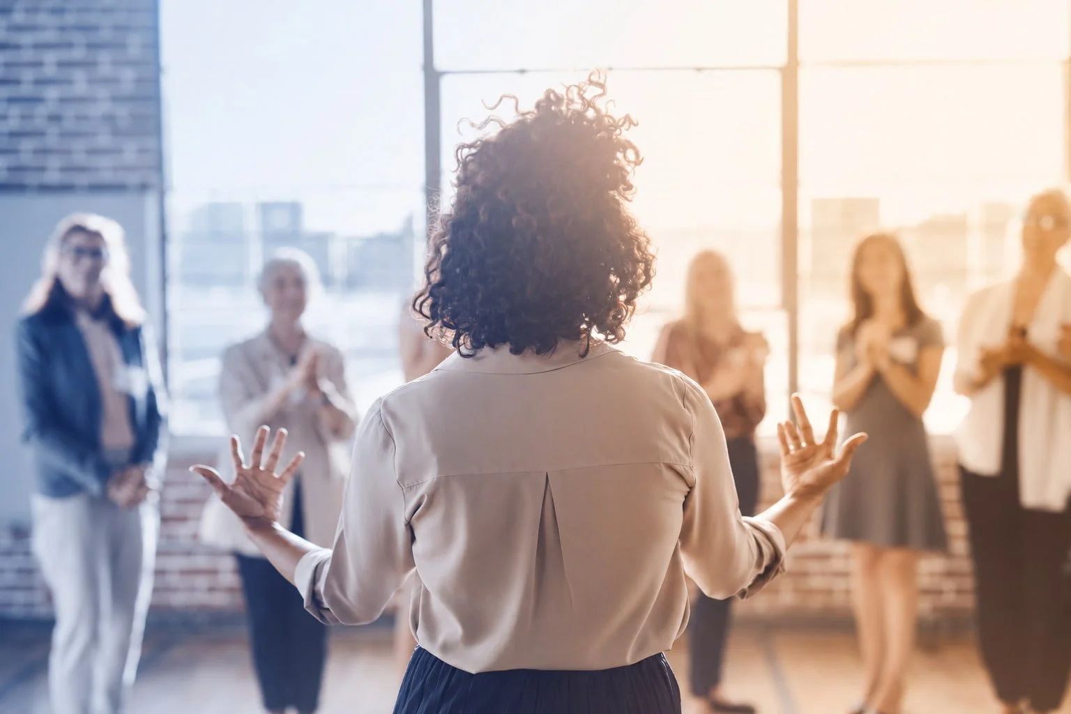 A woman presenting to a group