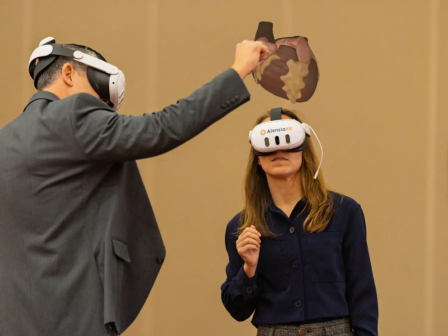 People using an XR device to look at the human heart
