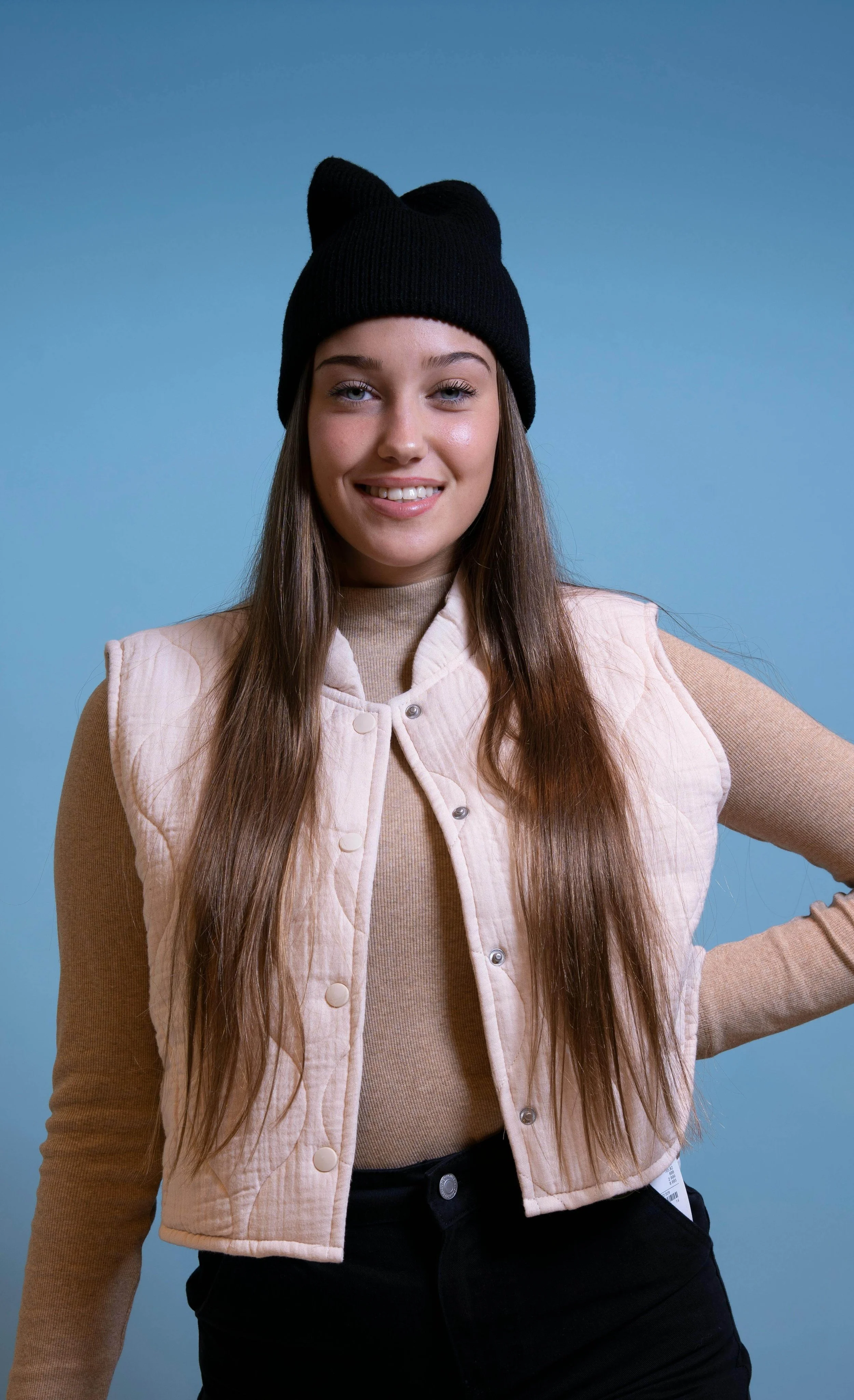 A smiling teen girl in front of a blue background. Worried about your teen’s social media use? Teen therapy in San Ramon, CA, can guide you and your teen toward open conversations and respectful online boundaries.