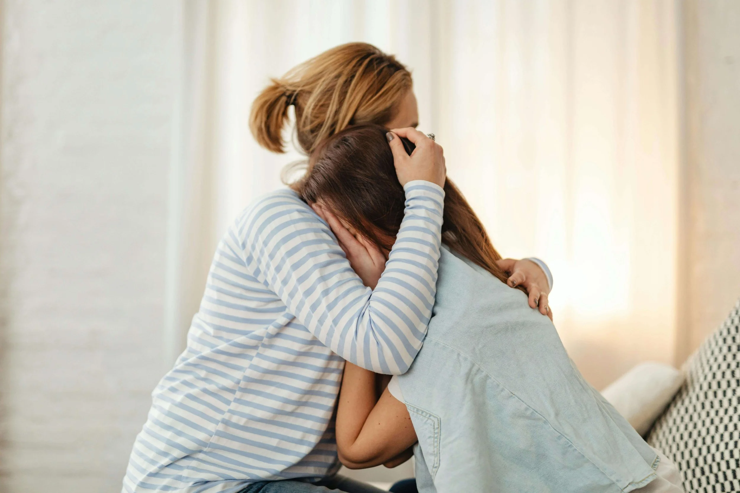 A mother embraces her distressed teen daughter. How can parents best support a teen who feels like they can never do anything right? Teen therapy in San Ramon, CA gives teens and parents practical tools to move forward together.