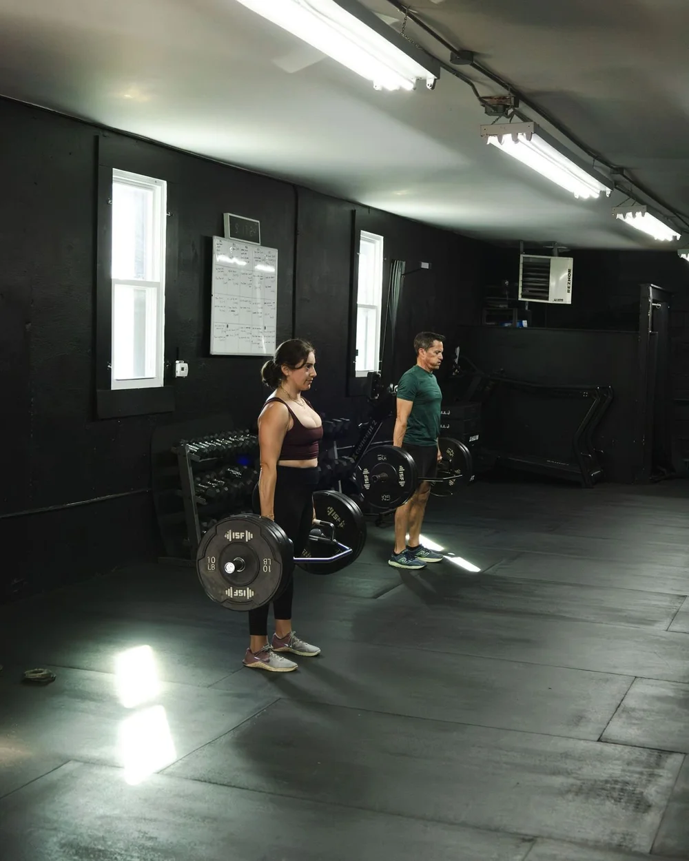 Members deadlifting together in class at Char Fitness Club, Montclair