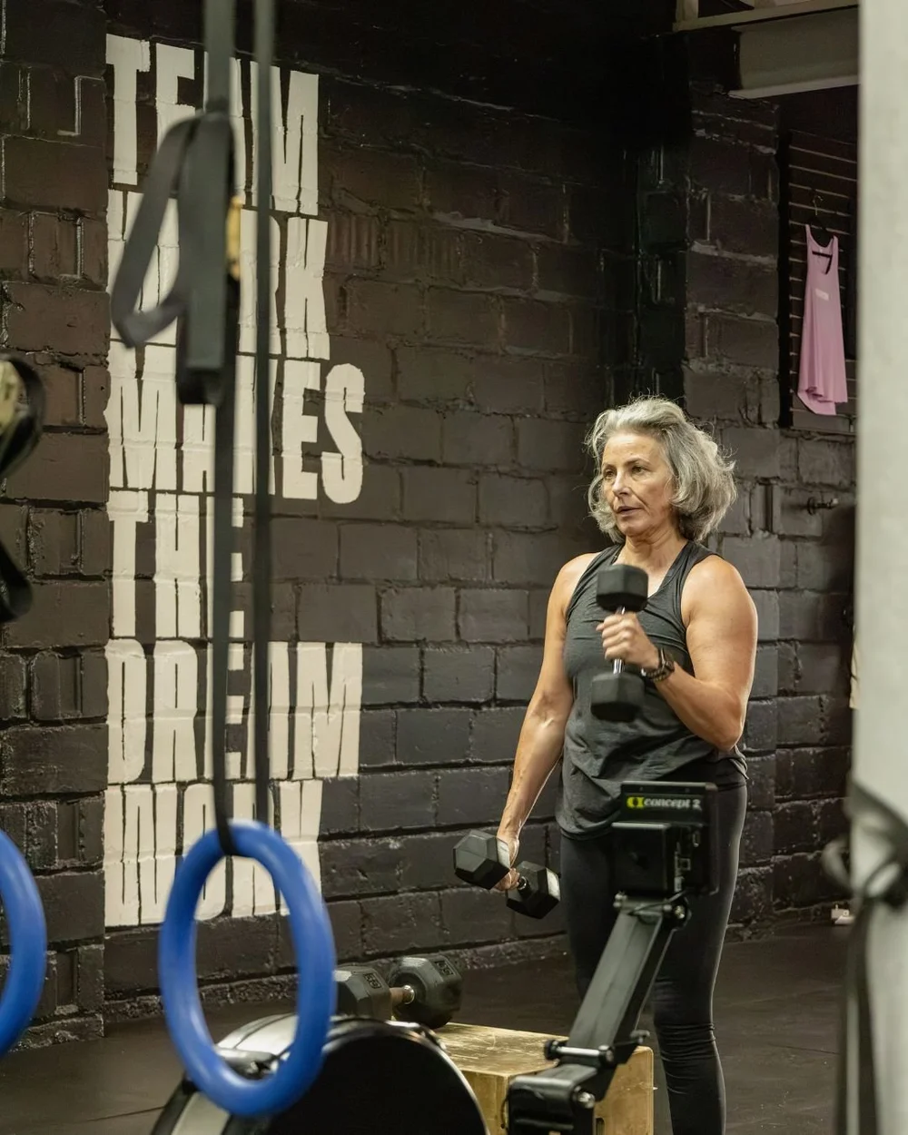 Member training with dumbbells at Char Fitness Club