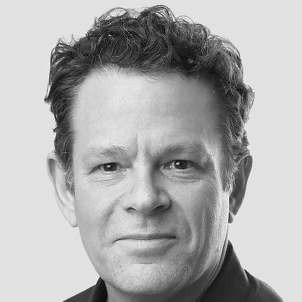 Black and white portrait of David Bornstein of Solutions Journalism Network