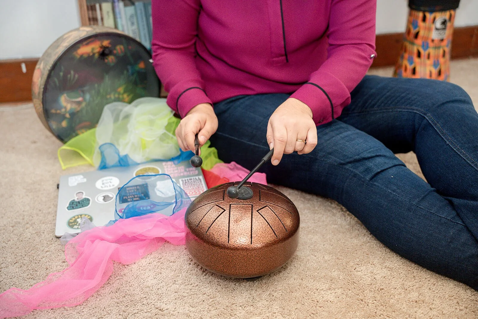 NY anxiety therapist plays small drum. In-person anxiety therapy sessions in NYC and online anxiety therapy in NY available here!