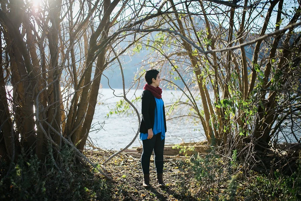 Woman standing and reflecting, representing self-awareness and anxiety despite understanding patterns
