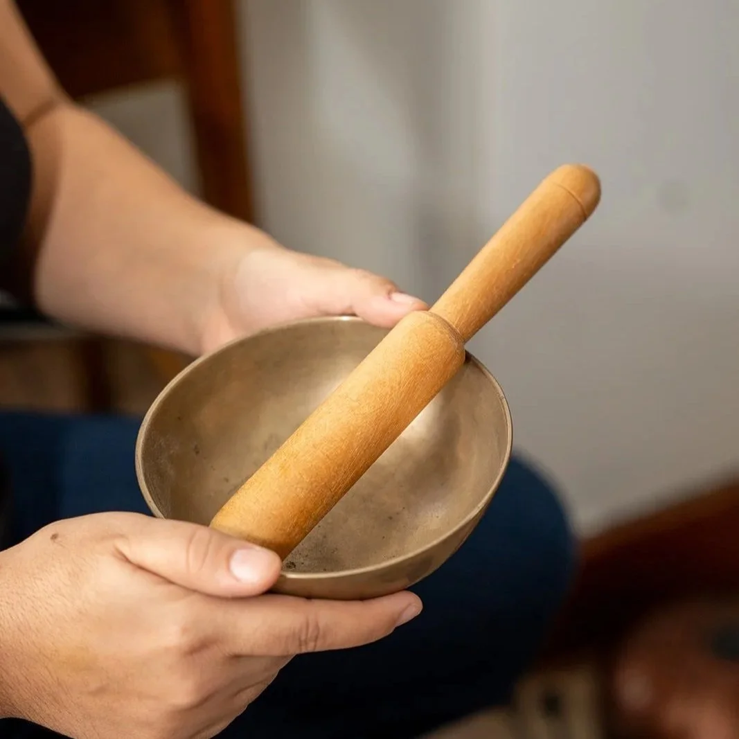 Woman practicing a somatic technique to calm her nervous system and soften anxiety symptoms.